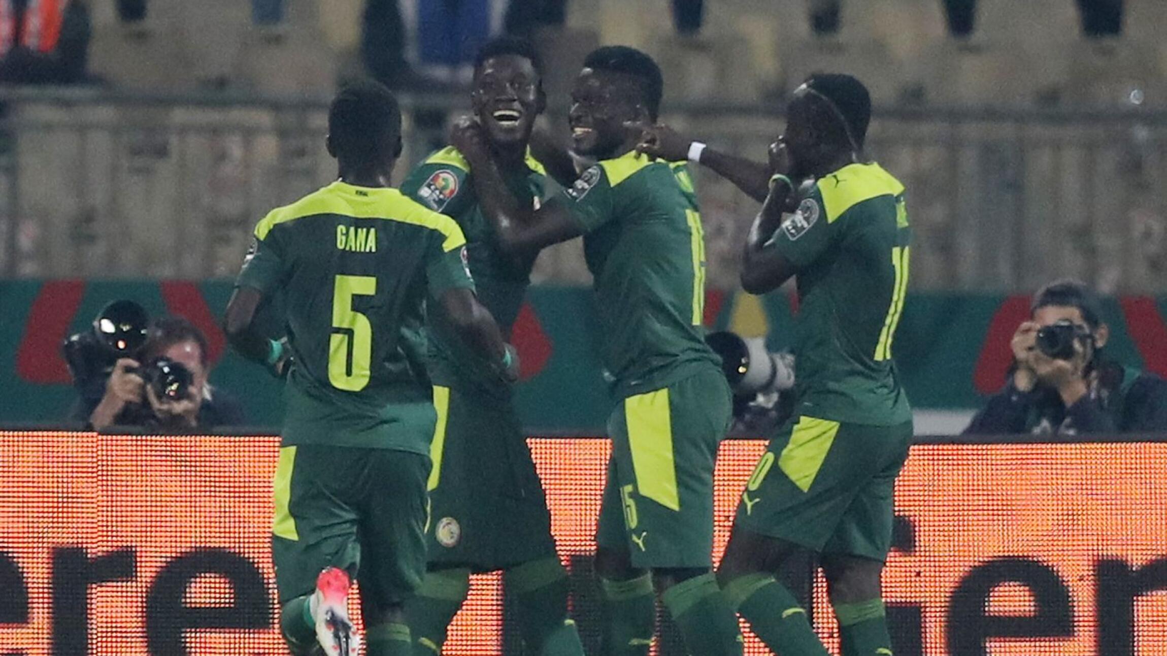Senegal's Ismaila Sarr celebrates with Bamba Dieng, Sadio Mane and Idrissa Gana Gueye after scoring their third goal during their Africa Cup of Nations quarter-final against  Equatorial Guinea