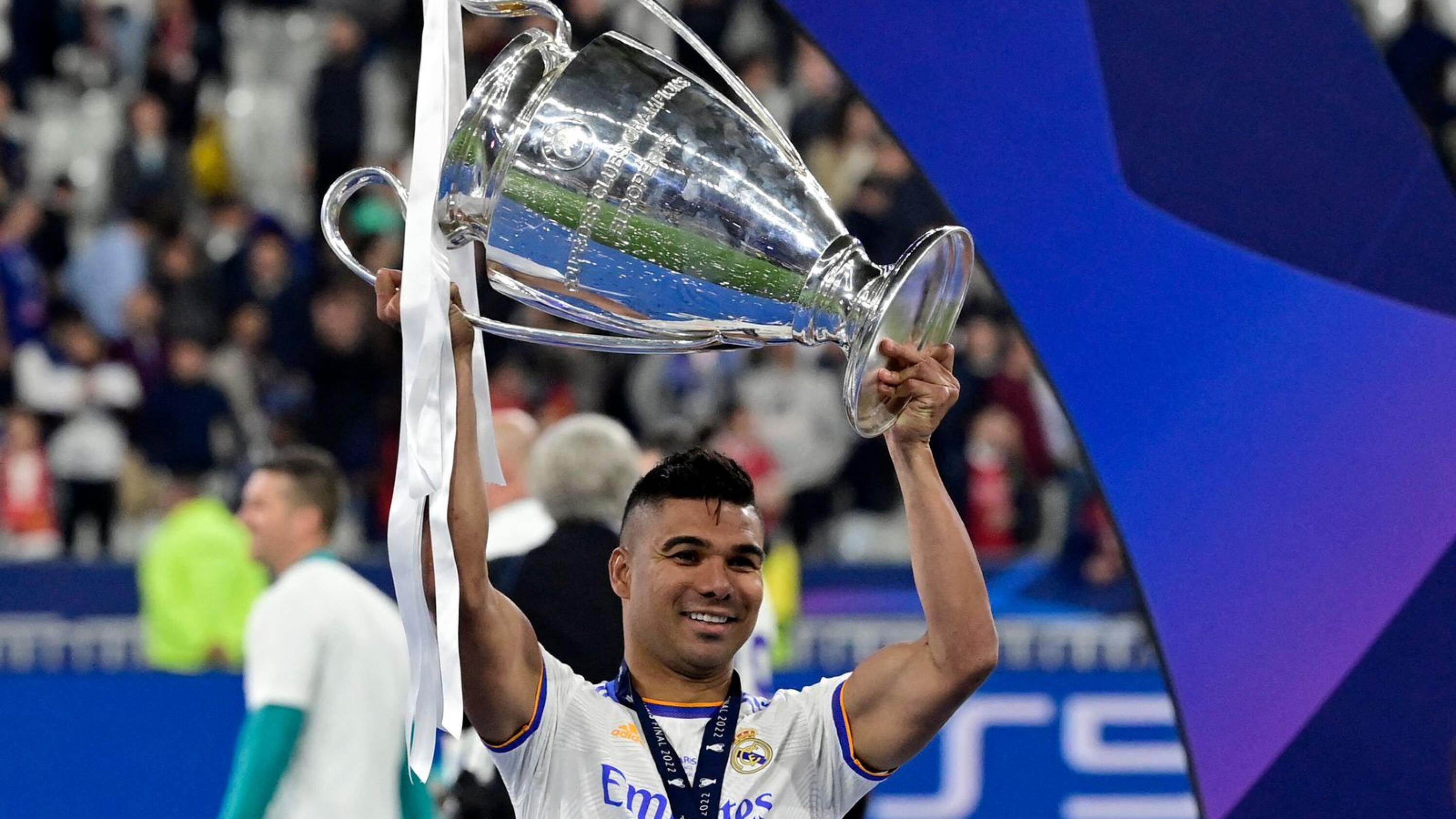 Former Real Madrid midfielder Casemiro celebrates with the Champions League trophy after they beat Liverpool in last season’s final at Stade de France in Saint-Denis