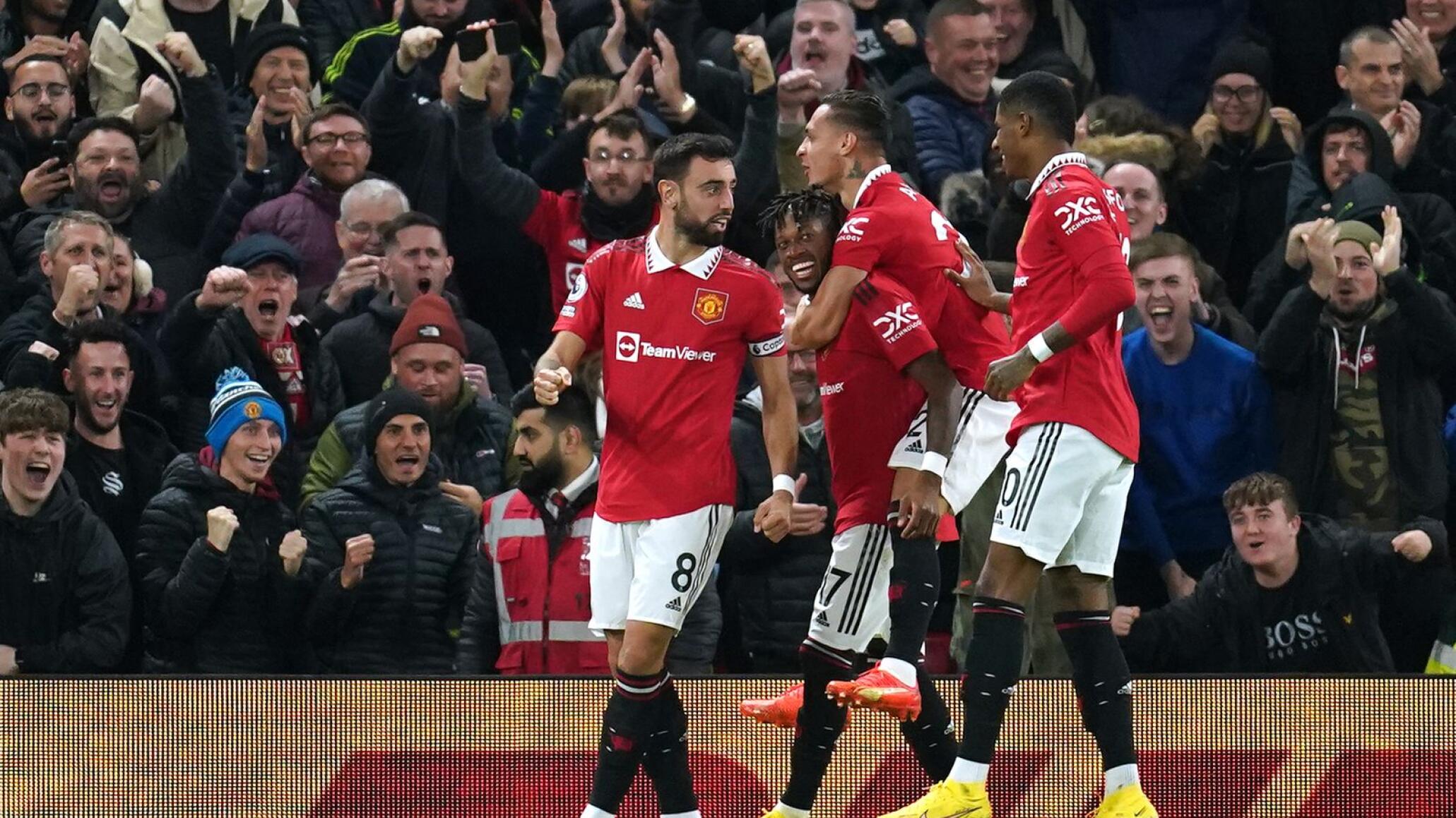 Manchester United soccer player celebrate after scoring a goal