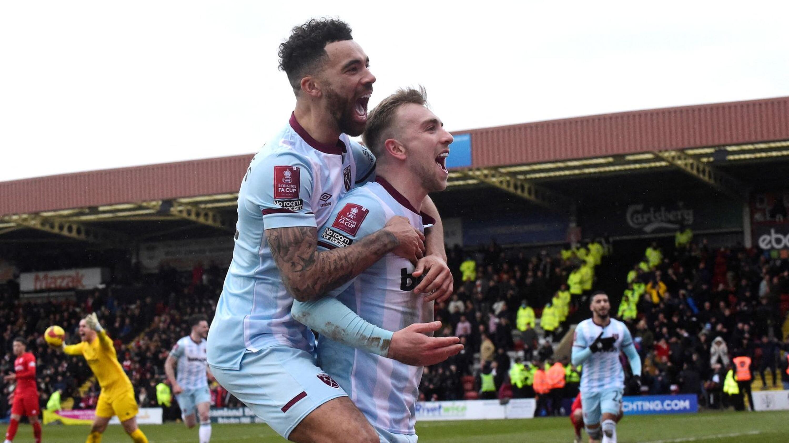 West Ham United's Jarrod Bowen celebrates with Ryan Fredericks after scoring the winning goal during their FA Cup fourth round game against Kidderminster Harriers on Saturday