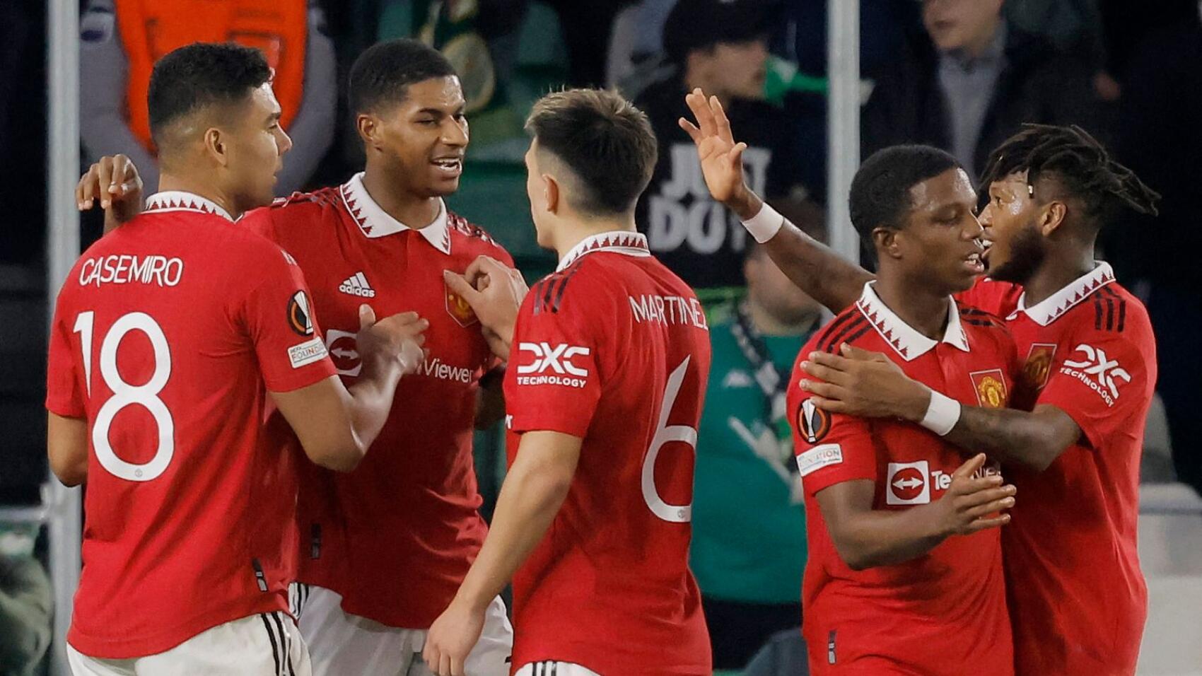 Manchester United's Marcus Rashford celebrates with teammates after scoring the only goal of the game during their Europa League clash against Real Betis at the Estadio Benito Villamarin in Seville on Thursday