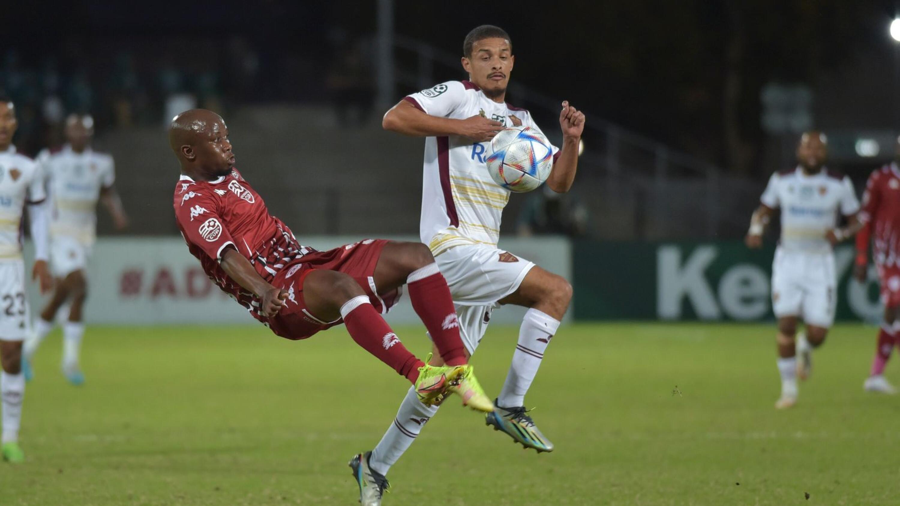 Siphosakhe Ntiya Ntiya of Sekhukhune United clears ball away from Devin Titus of Stellenbosch FC during their Nedbank Cup semi-final at Danie Craven Stadium in Stellenbosch on Sunday