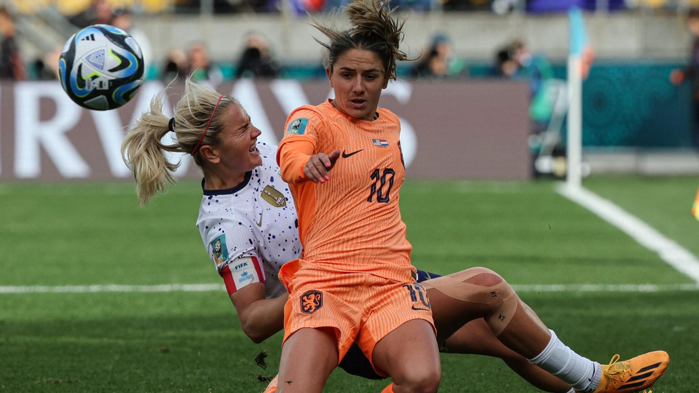 Netherlands' Danielle van de Donk fights for the ball with USA's Lindsey Horan during the Women's World Cup Group E football match at Wellington Stadium