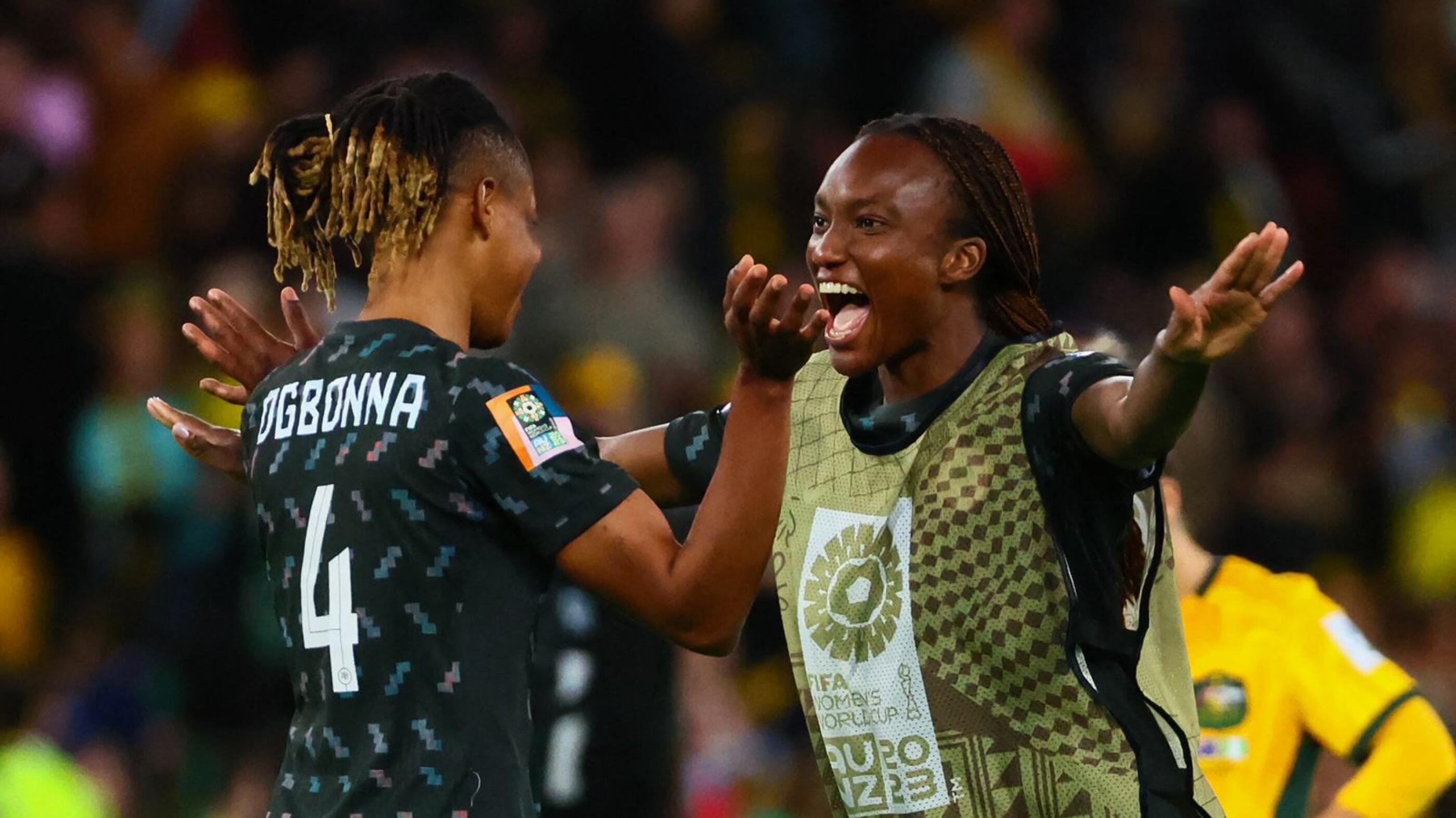 Nigeria's Ifeoma Onumonu (right) and teammate Glory Ogbonna celebrate their victory after the end of the  Women's World Cup Group B football match against Australia at Brisbane Stadium