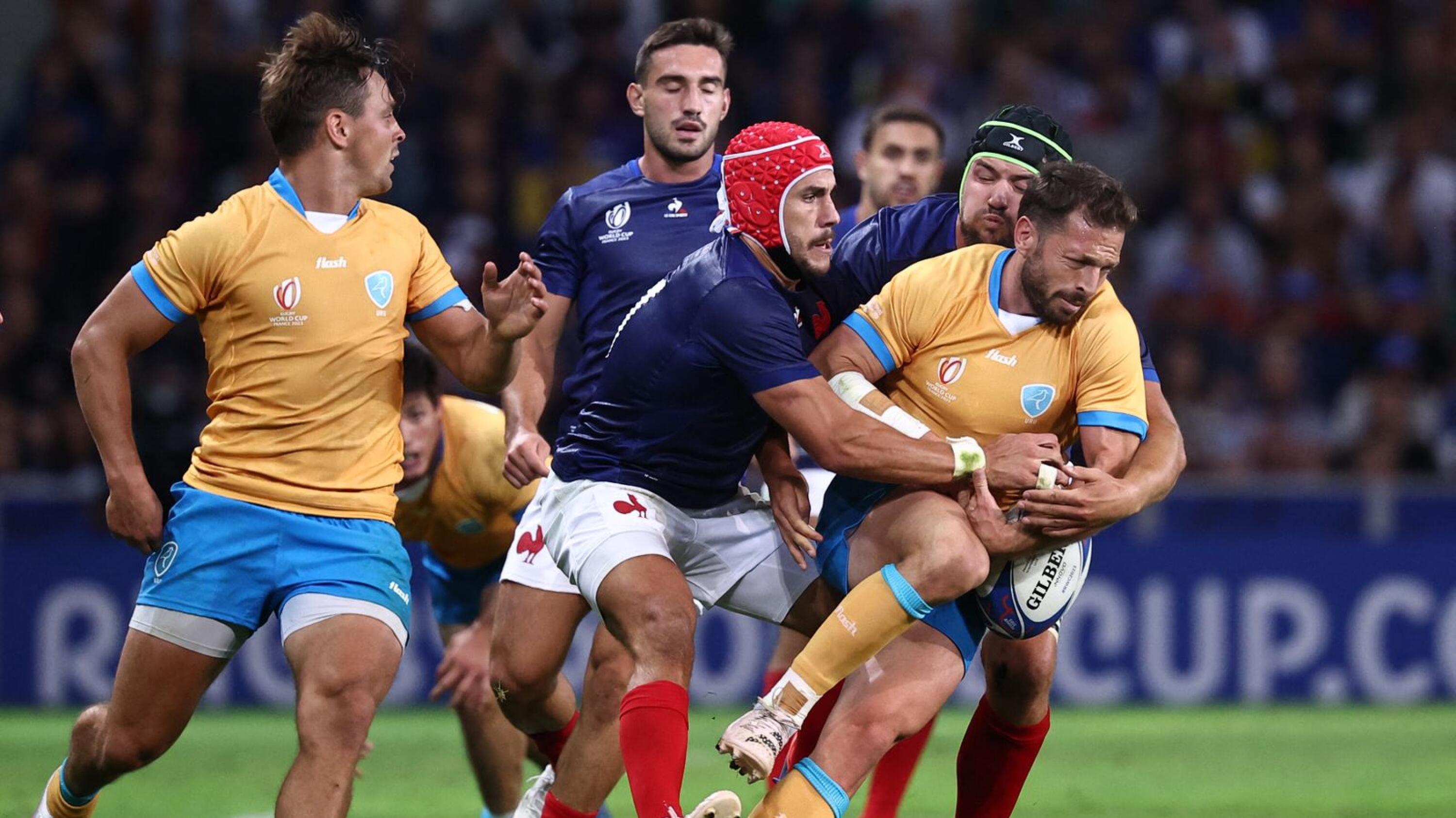 Uruguay's fly-half Felipe Berchesi is tackled by France's wing Gabin Villiere during their Rugby World Cup Pool A match against France at Pierre-Mauroy stadium in Lille