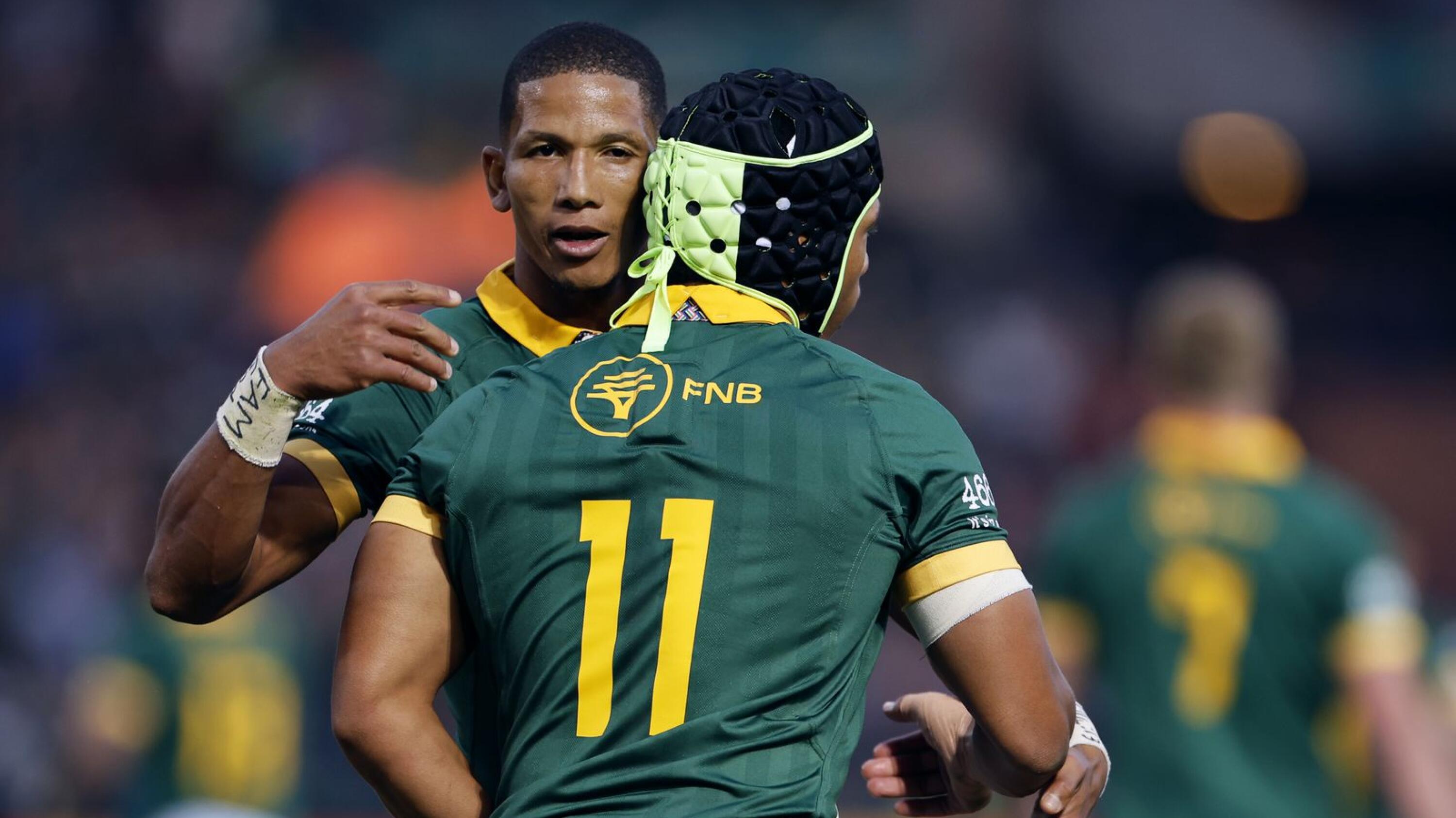 South Africa's wing Kurt-Lee Arendse (R) celebrates with South Africa's fly-half Manie Libbok (L)