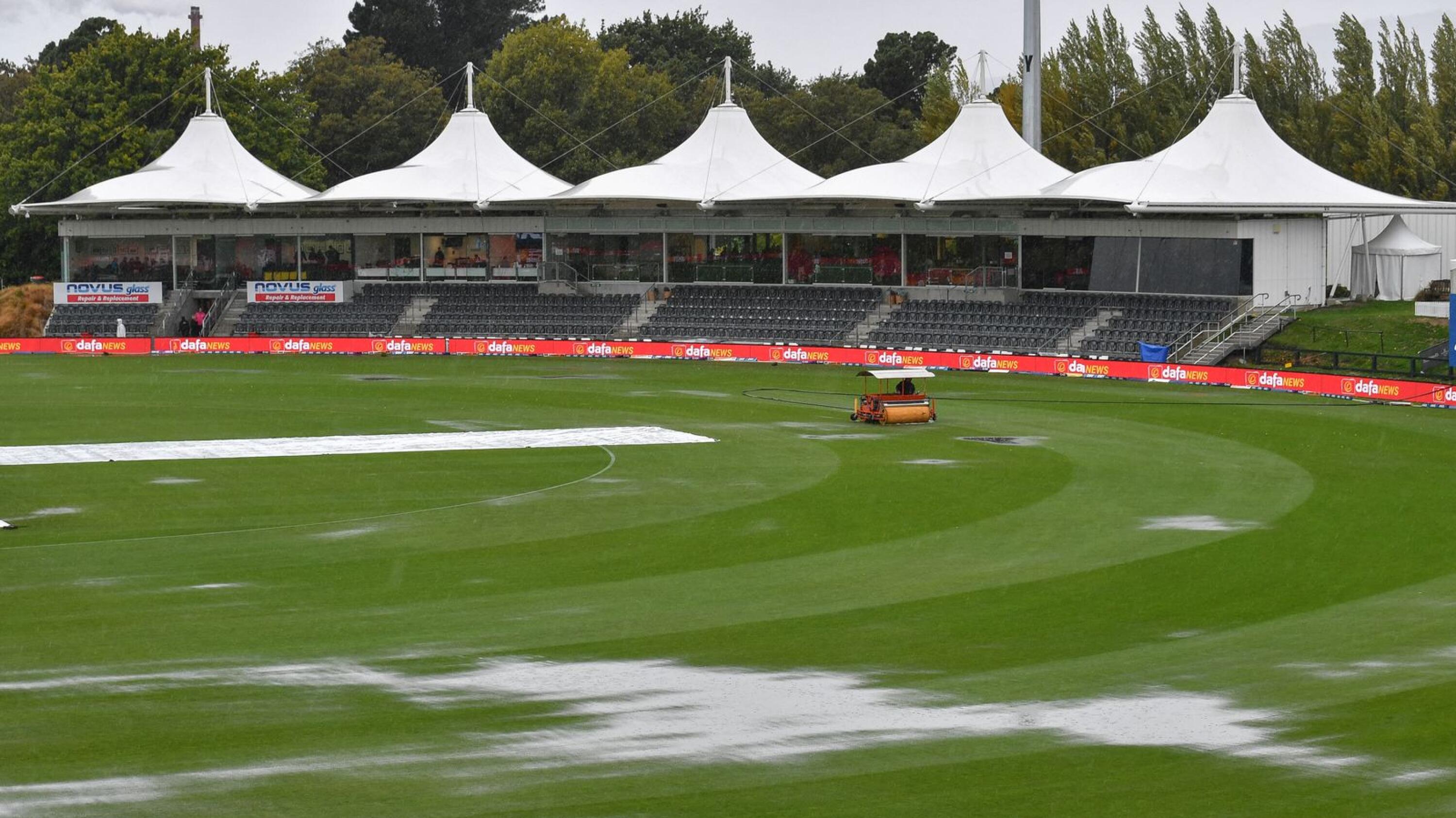 Puddles form on the field as rain falls before the start of the second one-day international cricket match between New Zealand and Sri Lanka at Hagley Oval in Christchurch on Tuesday