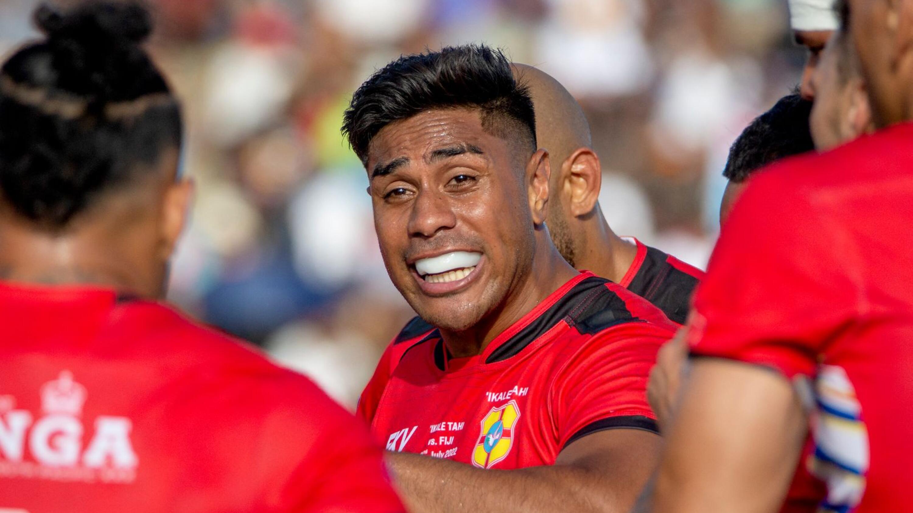 Former All Black Malakai Fekitoa talks to teammates while playing for Tonga