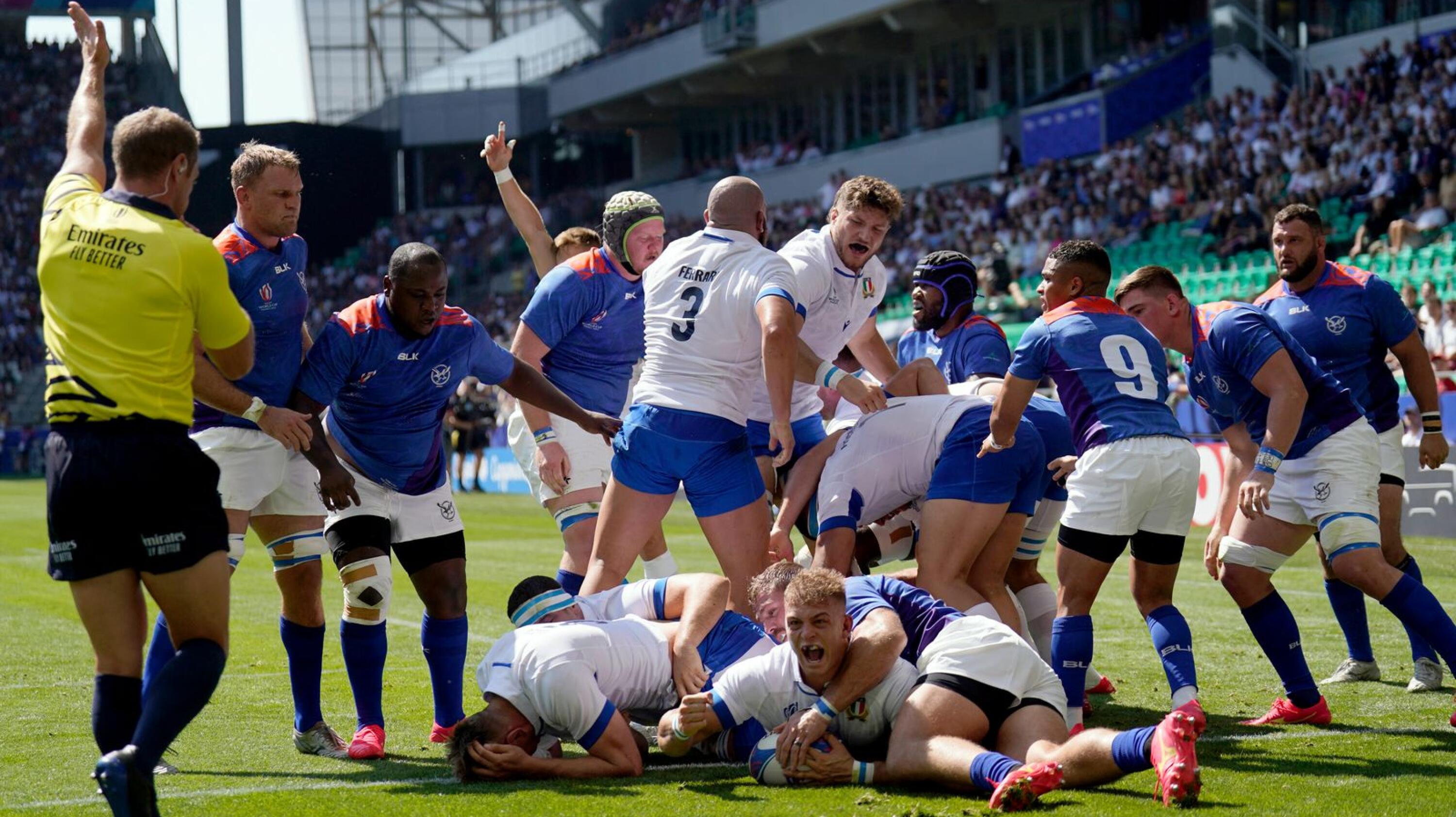 Italy's number eight Lorenzo Cannone crosses the line to score Italy's first try during their Rugby World Cup Pool A match against Namibia at Stade Geoffroy-Guichard in Saint-Etienne on Saturday