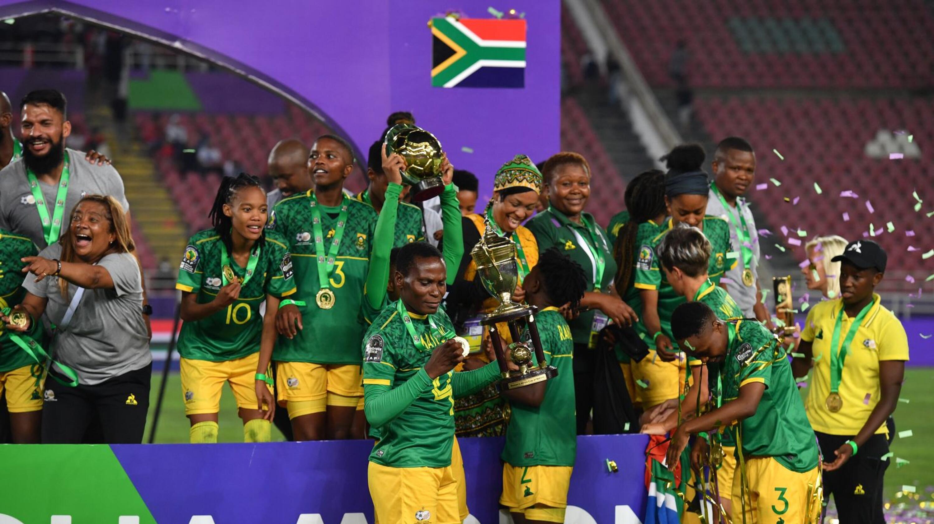 Banyana Banyana players celebrate with the trophy after beating Morocco in the fina of the Women's Africa Cup of Nations in Rabat last month