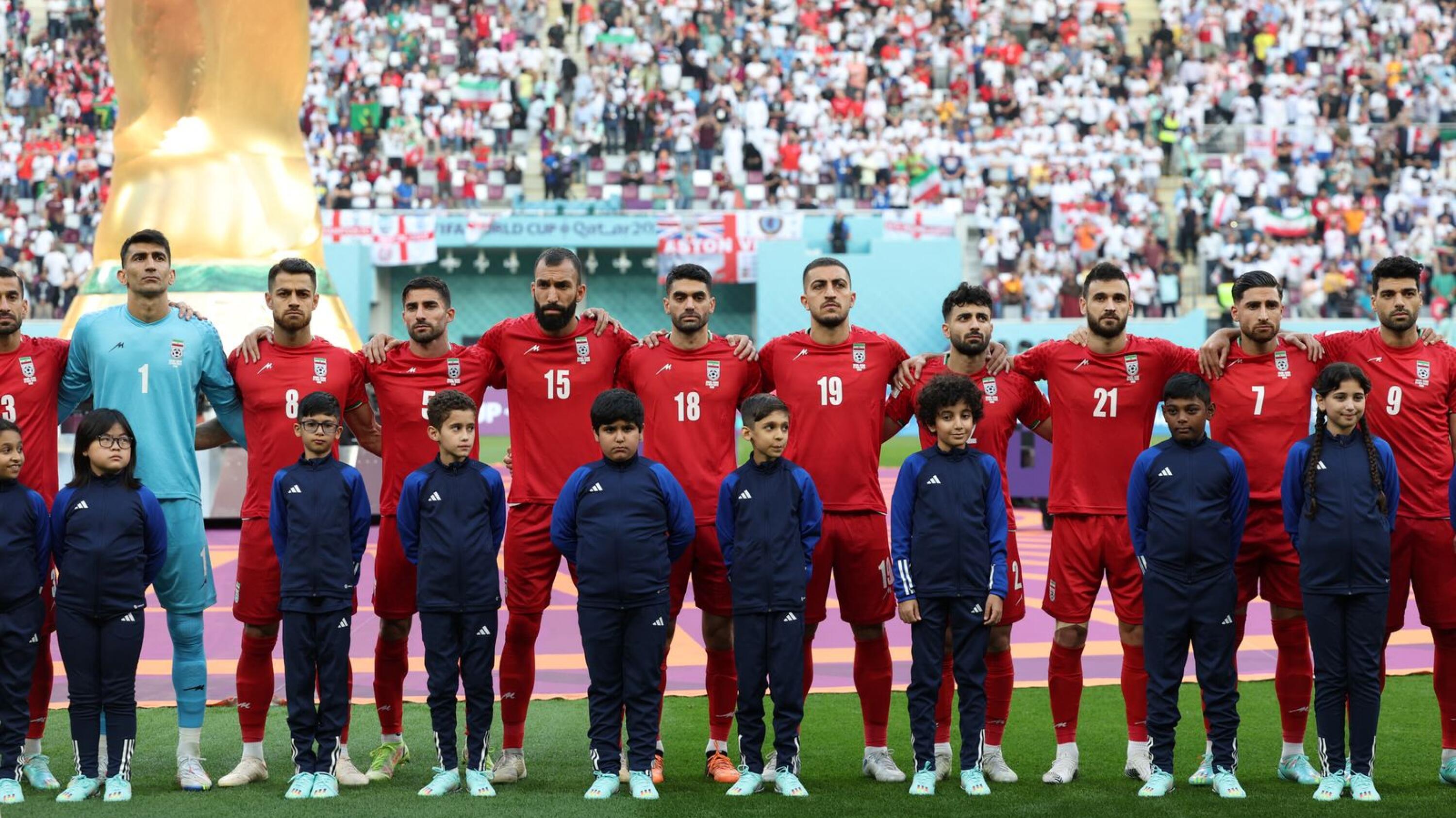 Iran players listen to their national anthem ahead of their match against England at the Khalifa International Stadium in Doha on Monday.