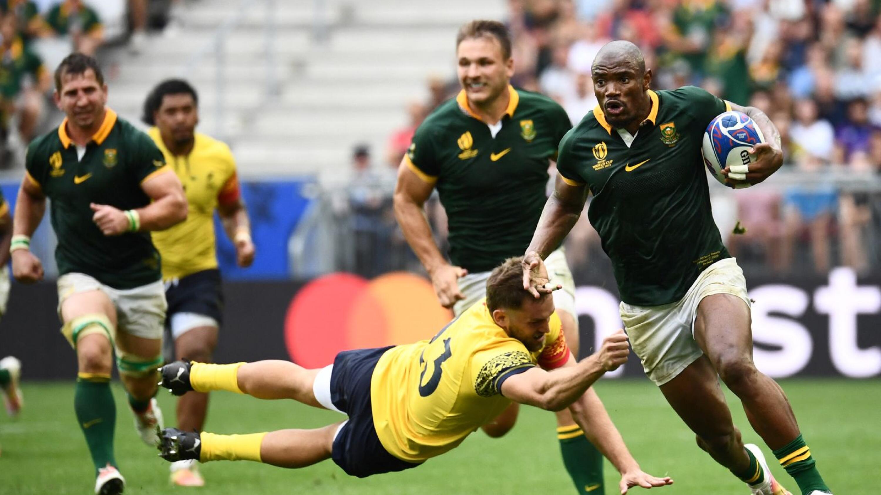 Springbok wing Makazole Mapimpi runs in to score the team's ninth try during their Rugby World Cup game against Romania