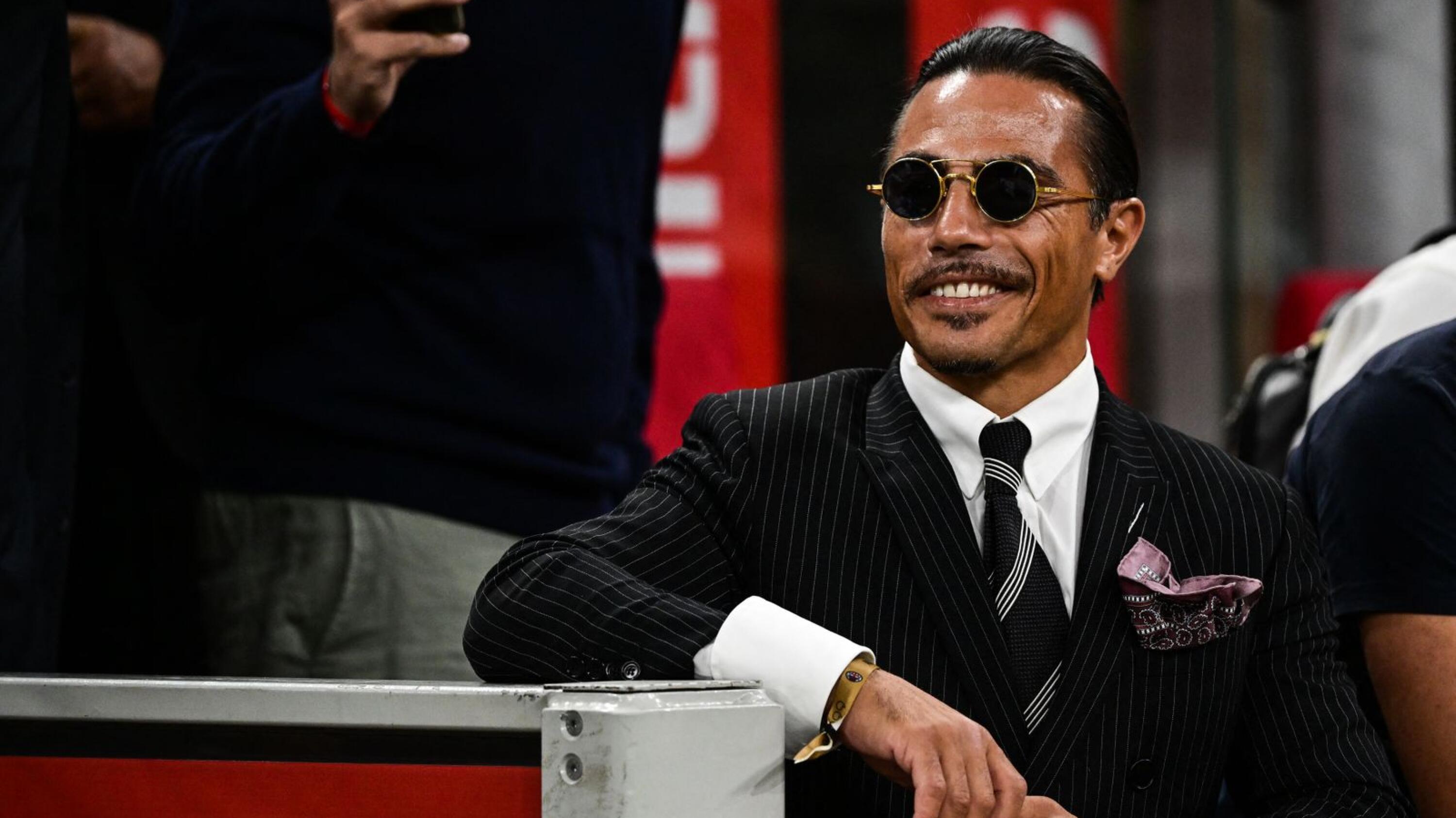 Turkish butcher, chef, food entertainer and restaurateur, Nusret Gokçe, nicknamed Salt Bae, attends the Italian Serie A football match between AC Milan and Napoli at the San Siro Stadium in Milan