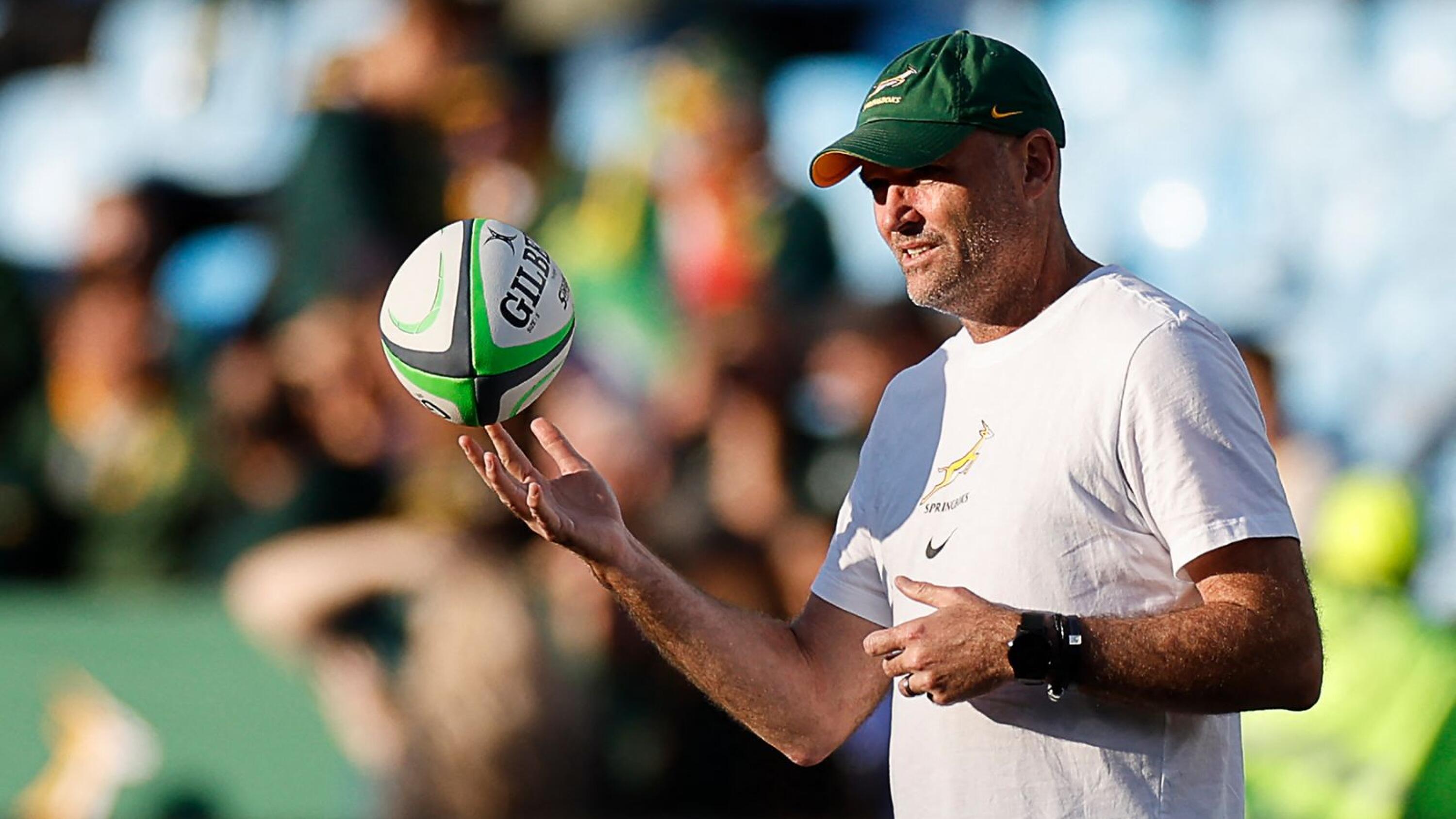 South Africa's coach Jacques Nienaber holds a ball during warm up prior to the Rugby Championship first round match between South Africa and Australia at Loftus Versfeld stadium in Pretoria