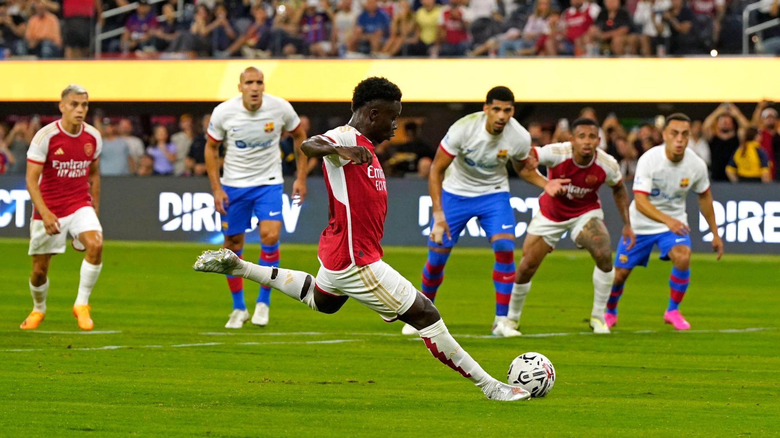 Bukayo Saka of Arsenal takes a penalty shot against Barcelona during the first half of their pre-season friendlyat SoFi Stadium