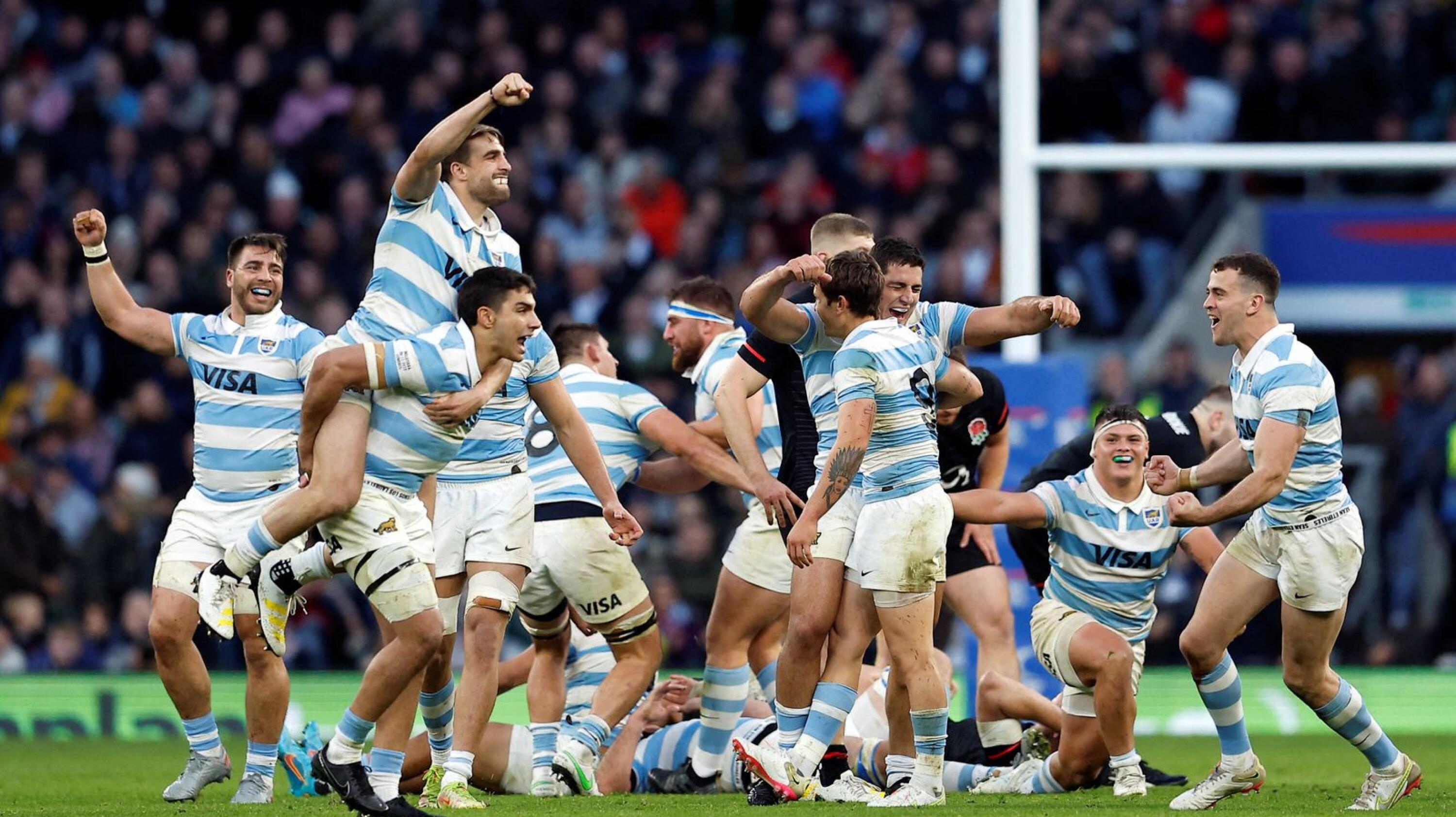 Argentina players celebrate after their Test match win against England at Twickenham Stadium in London on Sunday