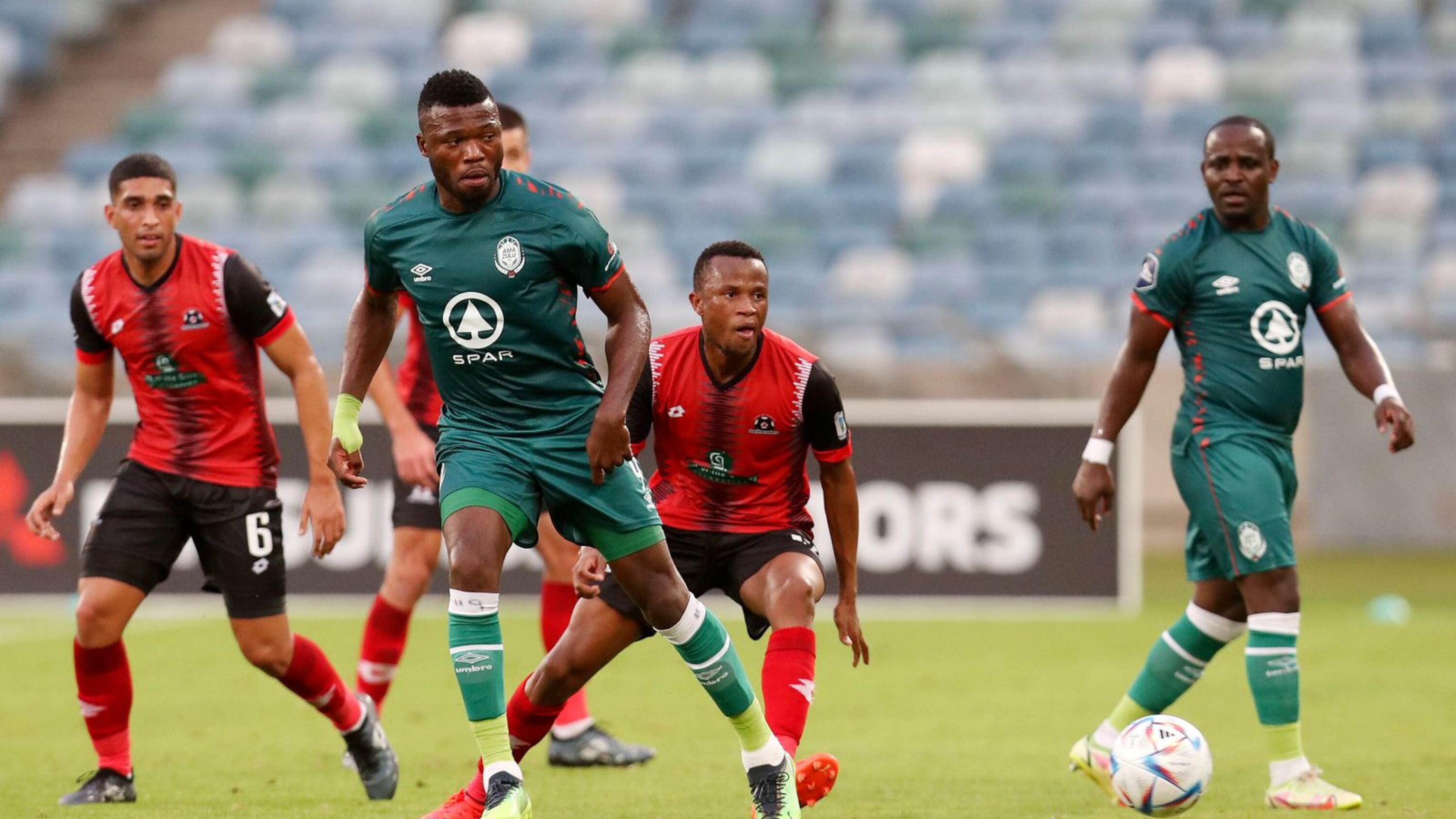 Augustine Kwem of AmaZulu is challenged by Bongani Sam of Maritzburg United during their DStv Premiership clash at the Moses Mabhida Stadium in Durban on Wednesday