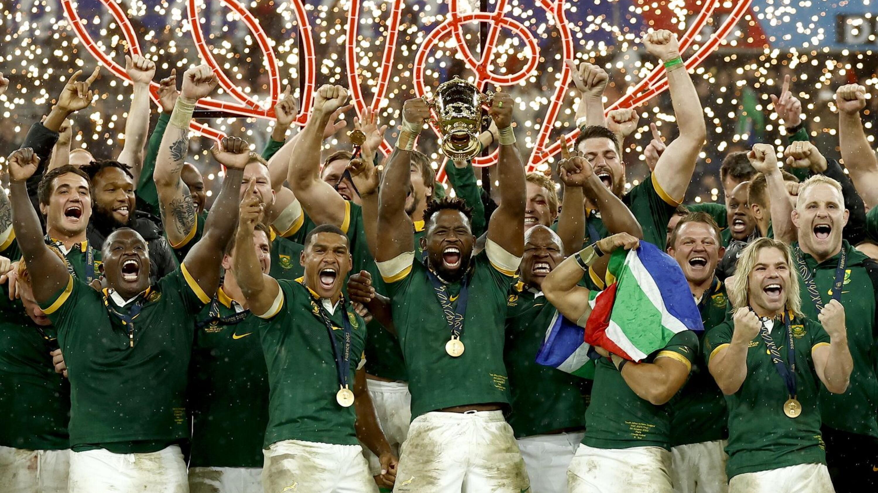 Springbok captain Siya Kolisi lifts the Webb Ellis trophy after the team won the Rugby World Cup final against New Zealand in Paris