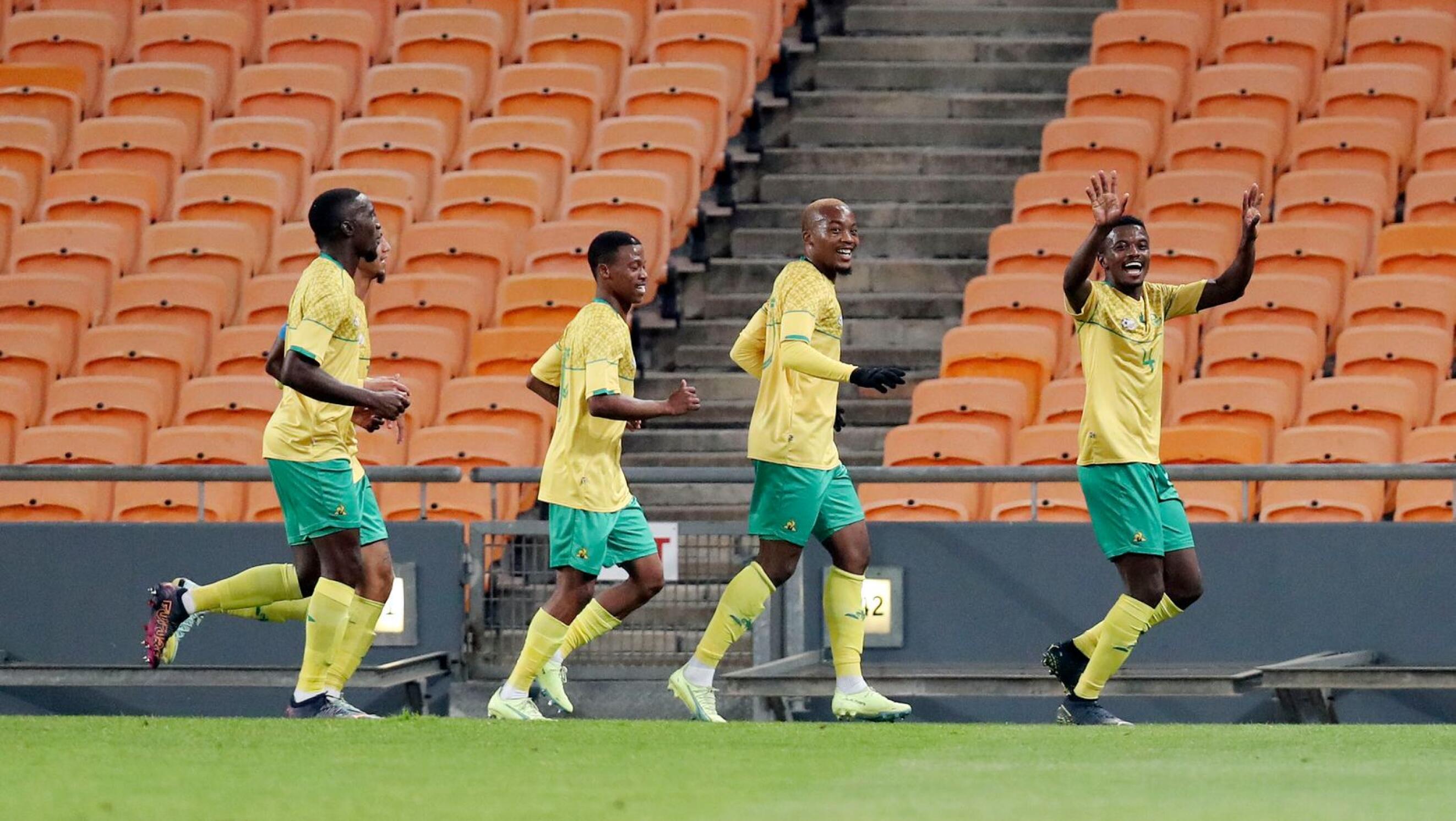 South Africa’s Teboho Mokoena celebrates with teammates after scoring a goal during their friendly international match against Botswana at FNB Stadium in Johannesburg on Tuesday