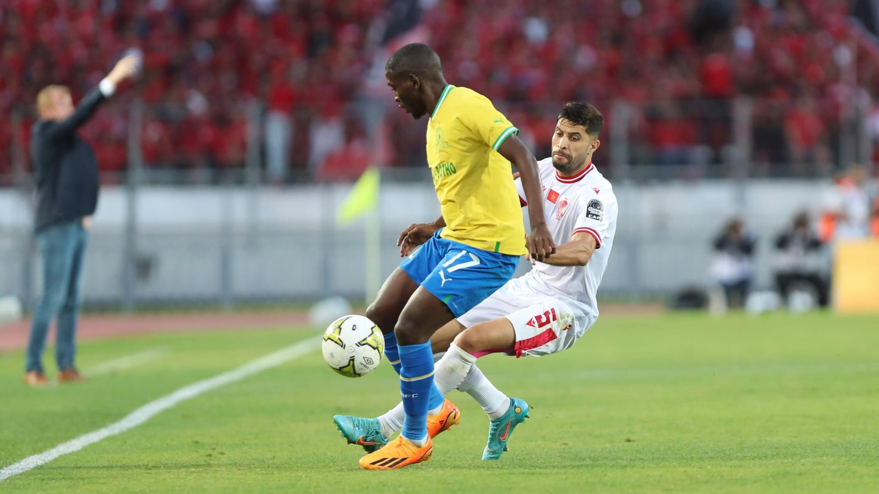 Aubrey Modiba of Sundowns is tackled by Yahya Jabrane of Wydad during their CAF Champions League semi-final, first leg at Mohammed V Stadium in Casablanca, Morocco on Saturday