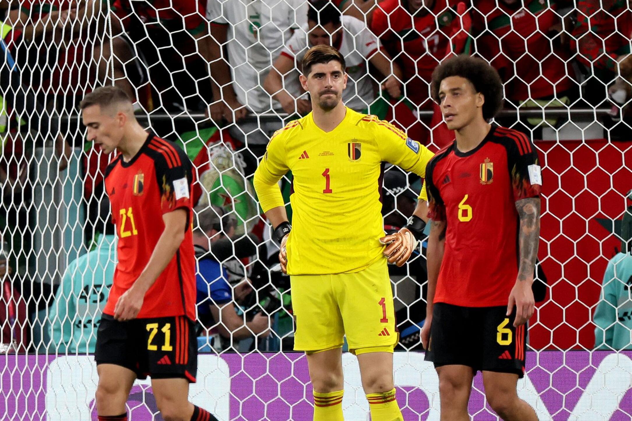 Belgium's Thibaut Courtois, Axel Witsel and Timothy Castagne react after conceding a goal during their Qatar 2022 World Cup Group F football match against Morocco at the Al-Thumama Stadium in Doha on Sunday