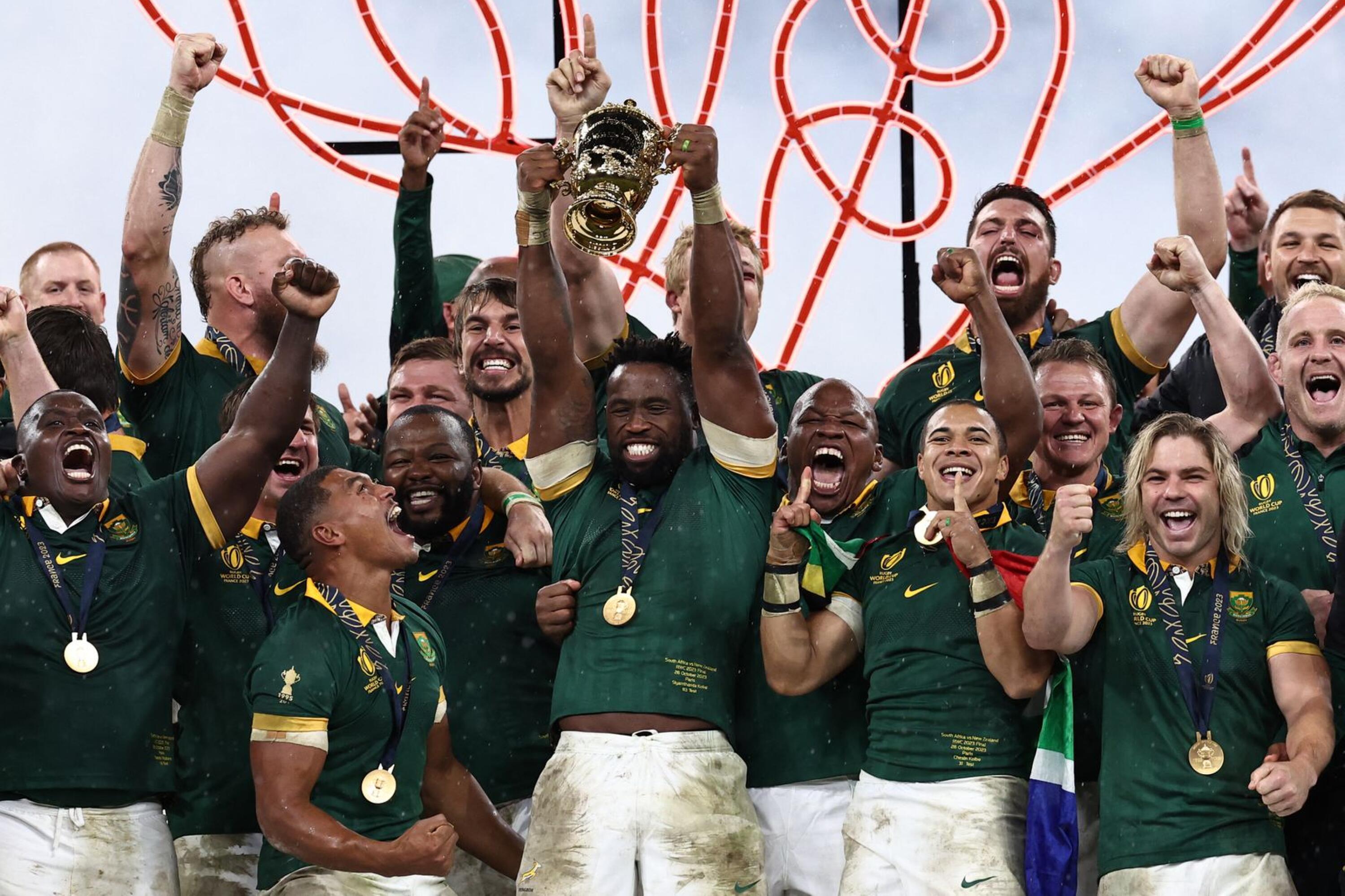 Springbok captain Siya Kolisi lifts the Webb Ellis Cup after they beat the All Blacks in the Rugby World Cup final at Stade de France