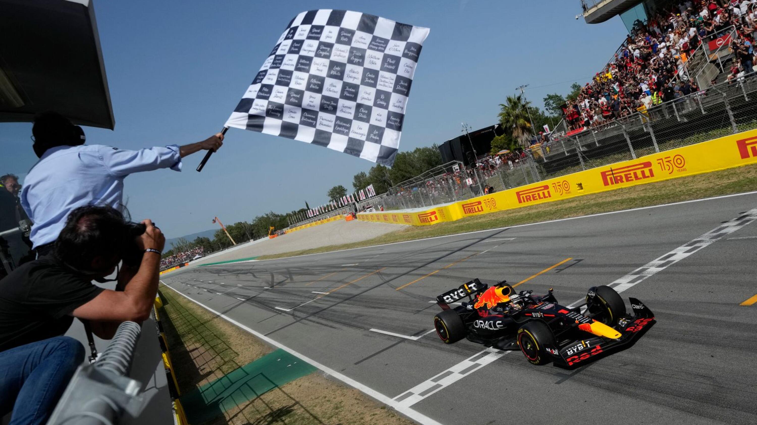 Red Bull's Dutch driver Max Verstappen crosses the finish line in first place during the Spanish Formula One Grand Prix at the Circuit de Catalunya in Montmelo, on the outskirts of Barcelona on Sunday
