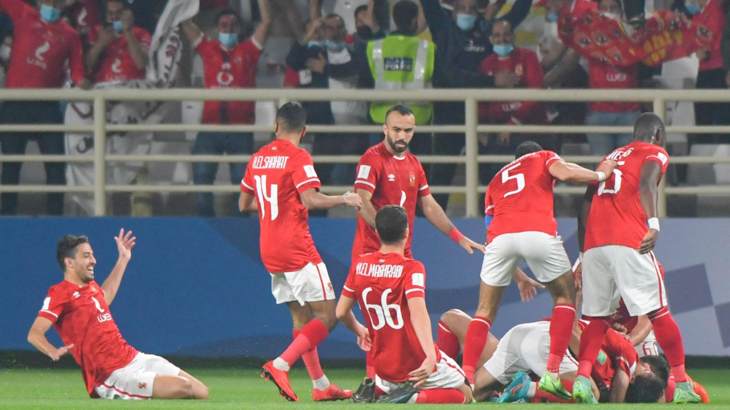 Al-Ahly players celebrate with defender Mohamed Hany after he scored the only goal during their FIFA Club World Cup football match against Mexico's Monterrey at al-Nahyan Stadium in Abu Dhabi on Saturday
