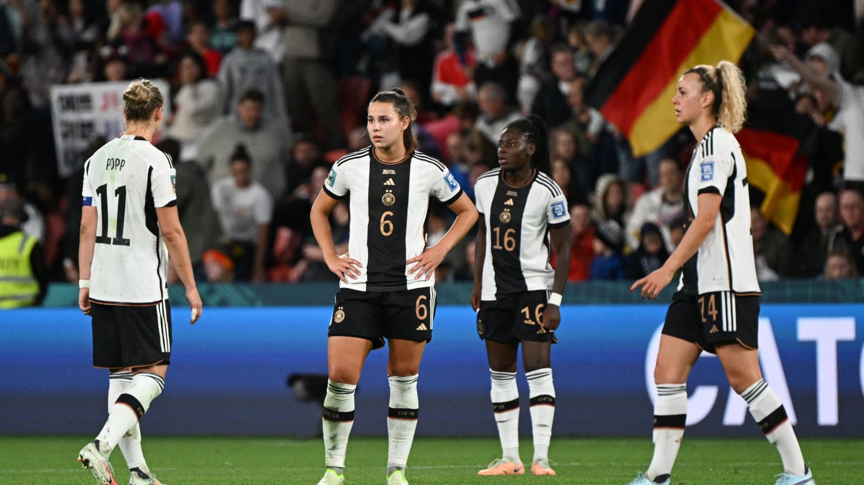 Lena Oberdorf and teammates look dejected after Germany are knocked out of the World Cup after their draw against South Korea on Thursday