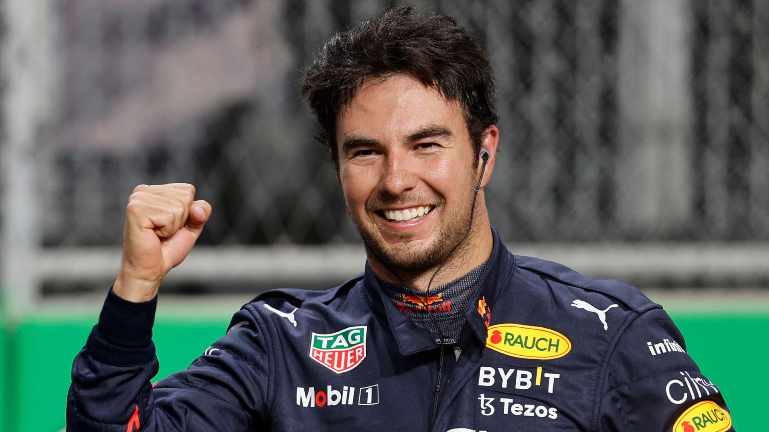 Red Bull's Sergio Perez celebrates after finishing in pole position after qualifying