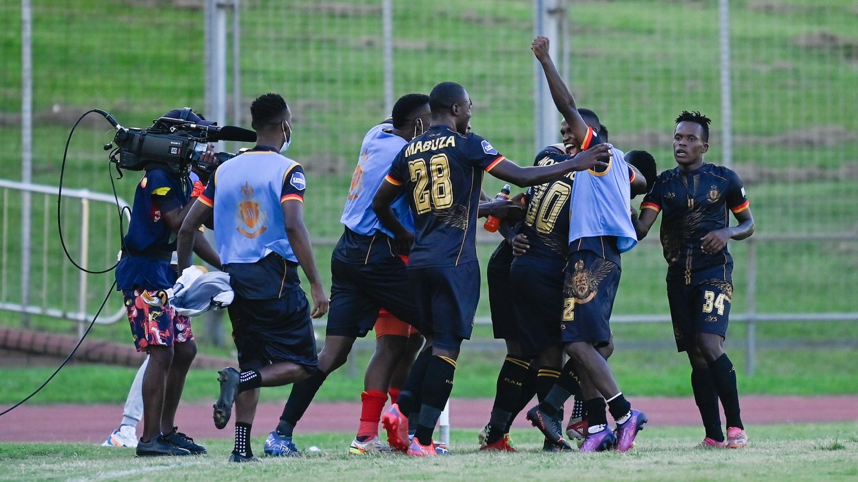 Royal AM players celebrate after Elias Pelembe scored a goal in the dying moments of their DStv Premiership match against Swallows FC at Chatsworth Stadium in Durban on Sunday