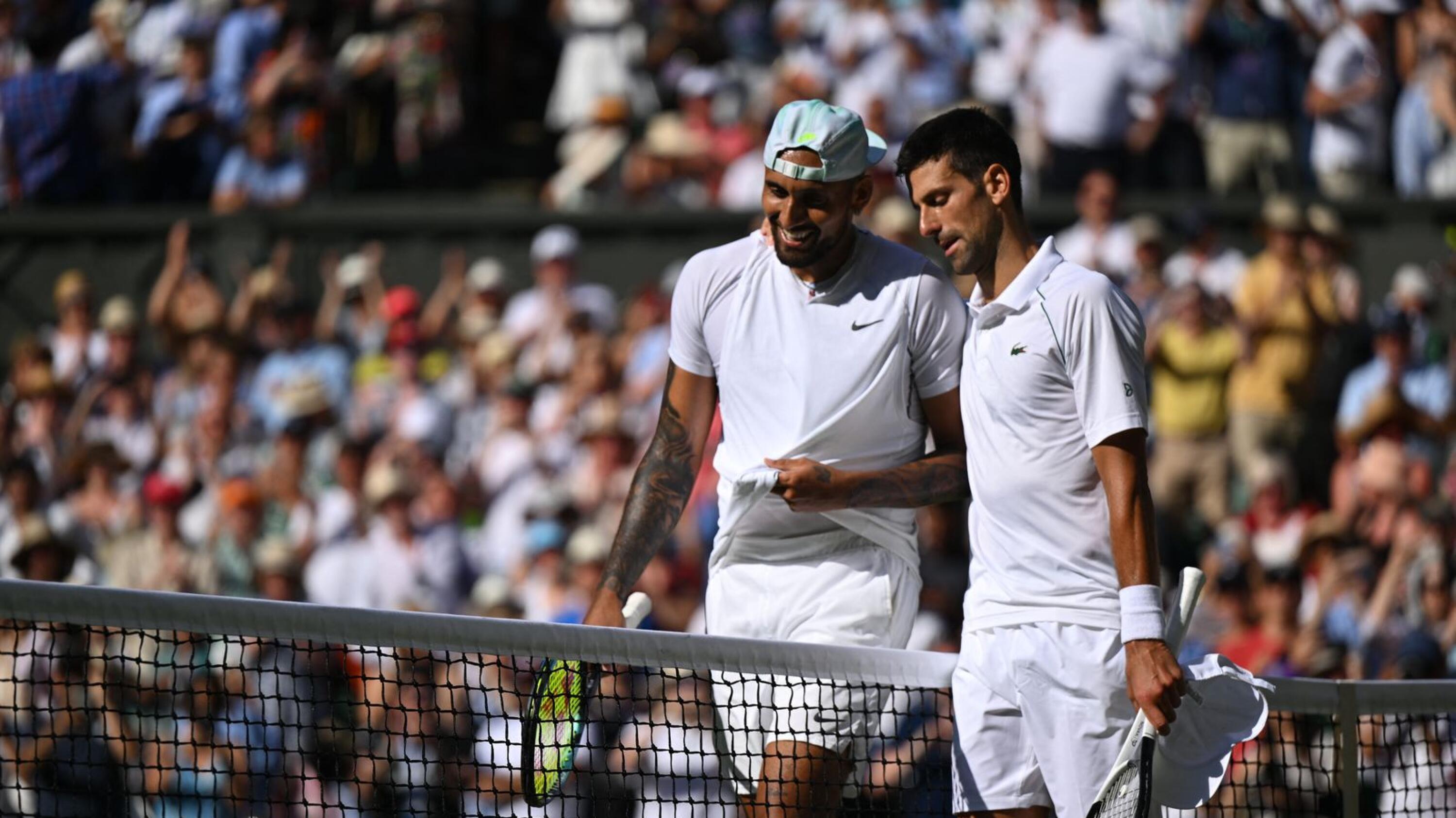 Australia's Nick Kyrgios congratulates Serbia's Novak Djokovic for his victory after their men's singles final tennis match on the fourteenth day of the 2022 Wimbledon Championships at The All England Tennis Club in Wimbledon, southwest London, on Sunday