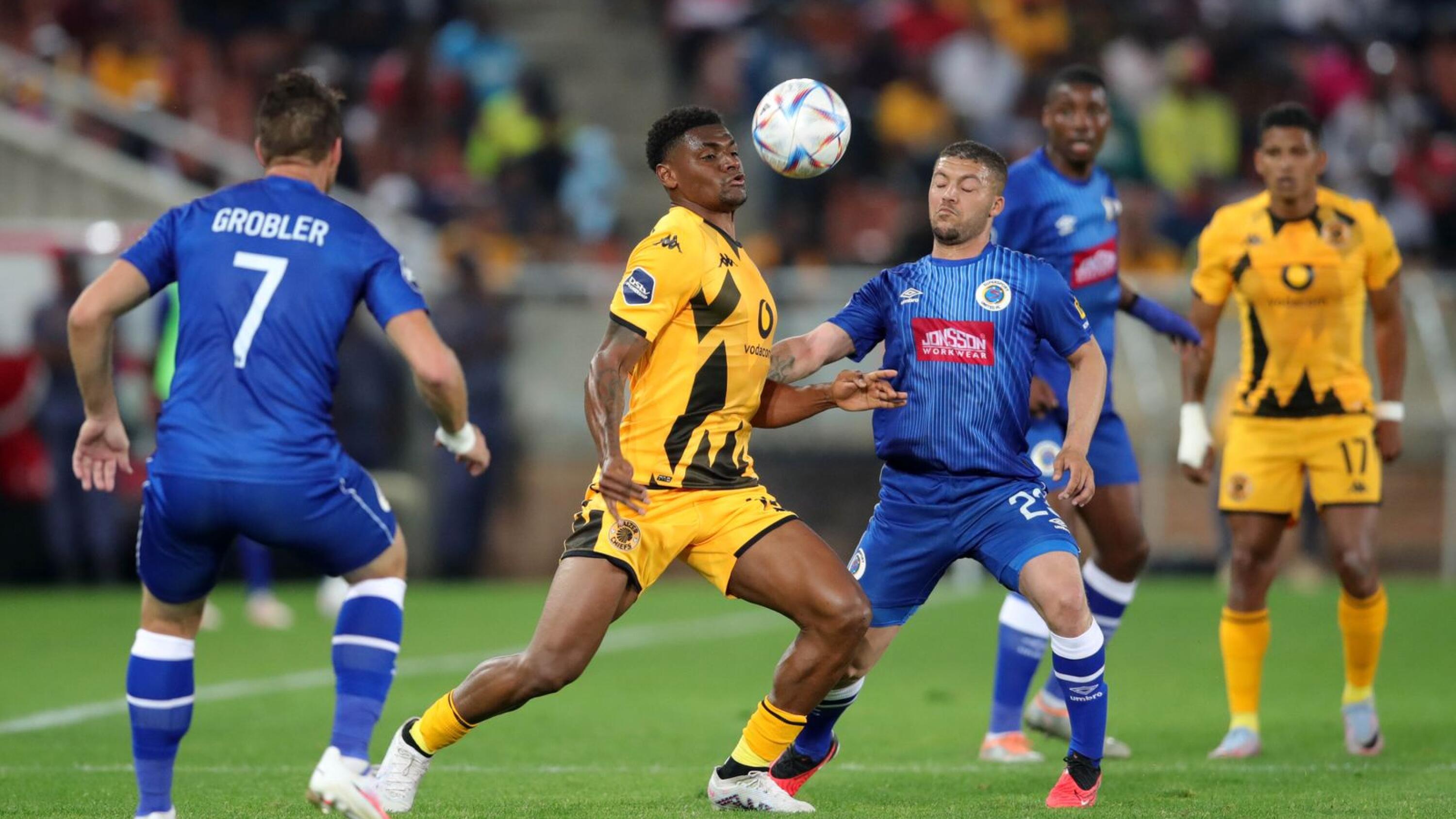 Jasond Gonzalez of Kaizer Chiefs is challenged by Grant Margeman of SuperSport United during their DStv Premiership match at Peter Mokaba Stadium in Polokwane on Wednesday