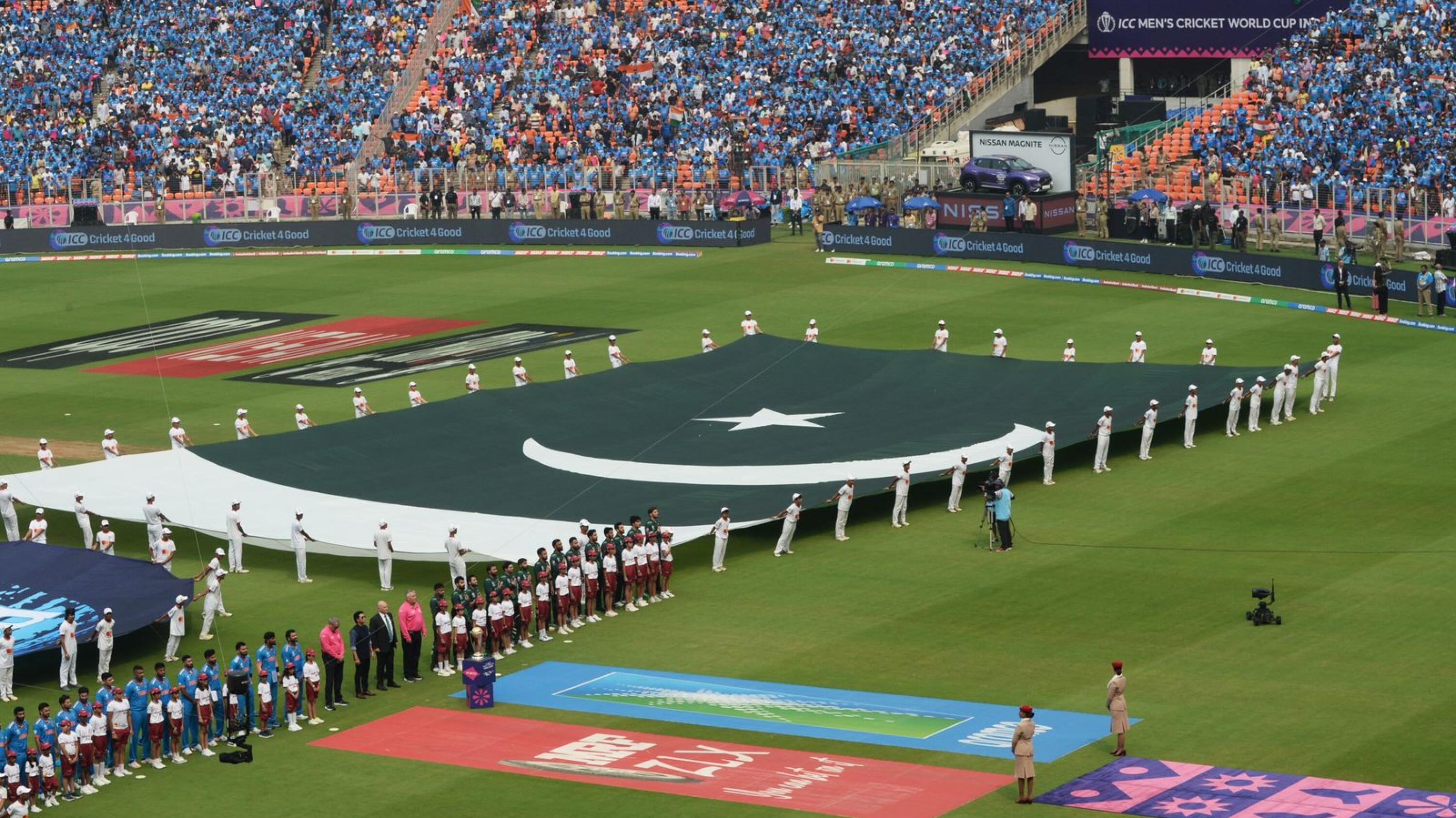 A large national flag of Pakistan is displayed before the start of ICC Men’s Cricket World Cup match between India and Pakistan at the Narendra Modi Stadium in Ahmedabad