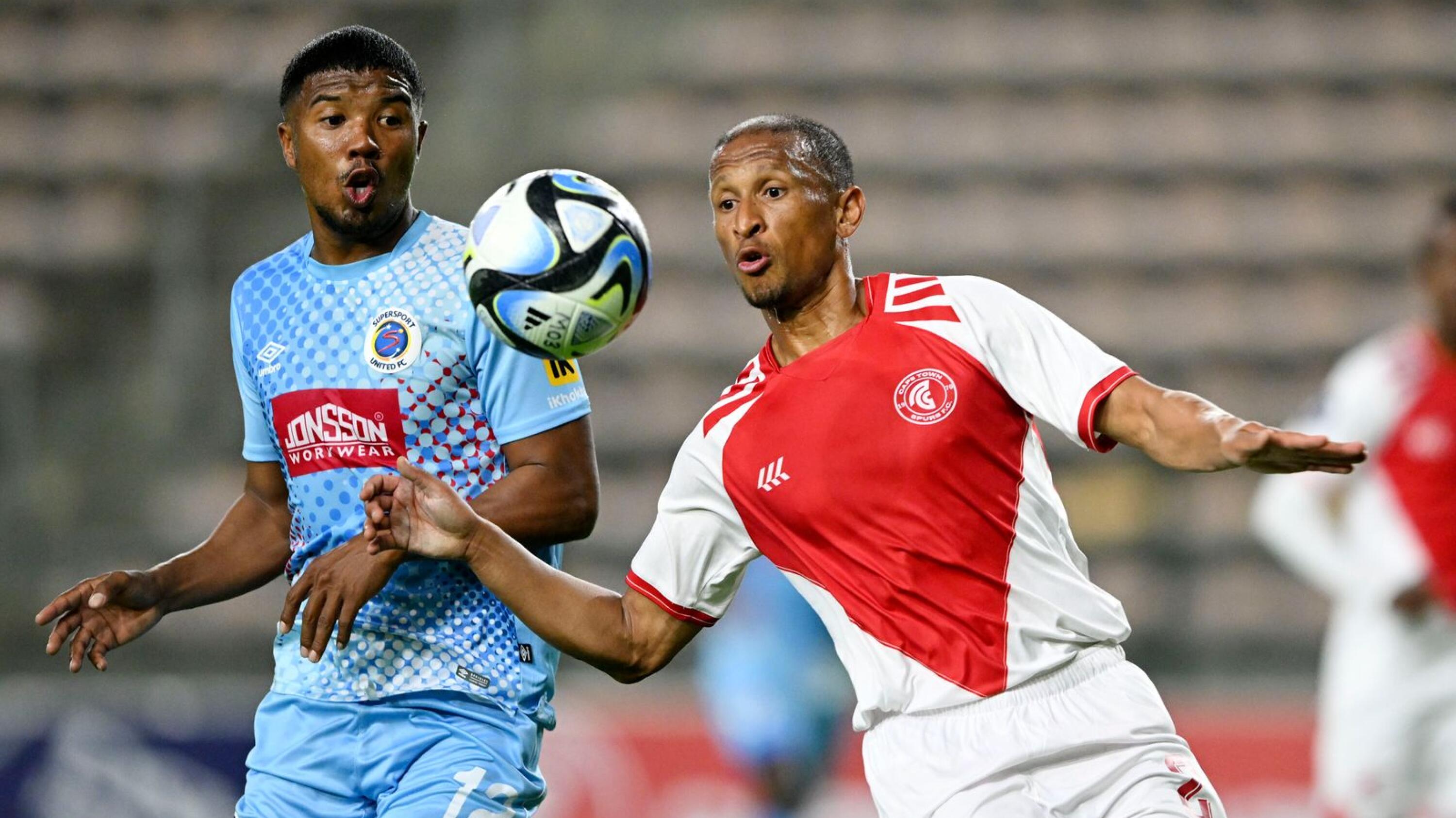 Nazeer Allie of Cape Town Spurs is challenged by Lyle Lakay of Supersport United during their DStv Premiership match at Athlone Stadium in Cape Town on Wednesday