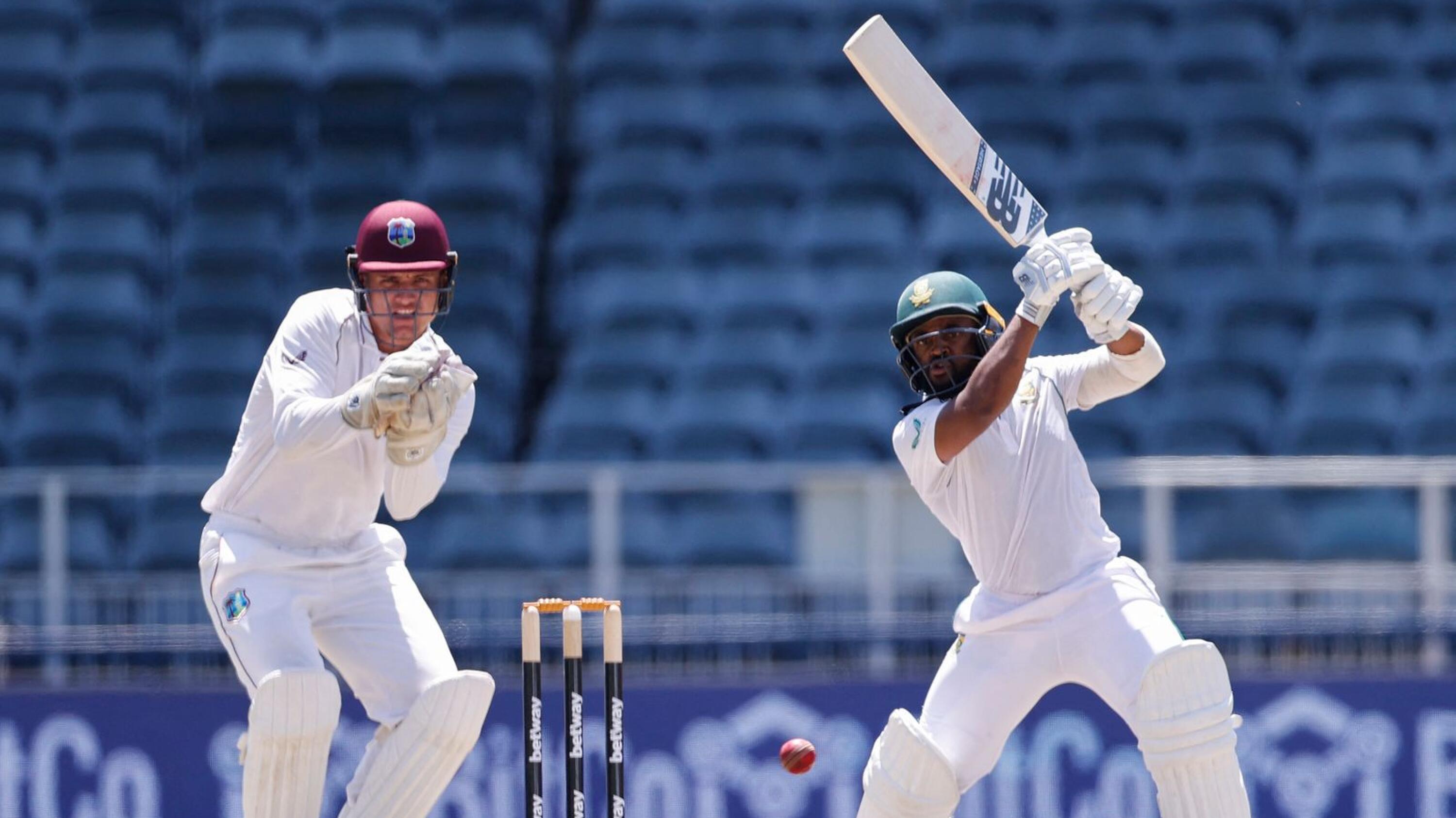 South Africa's Temba Bavuma plays a shot as West Indies wicketkeeper Joshua Da Silva looks on during the third day of the second Test at The Wanderers Stadium in Johannesburg on Friday