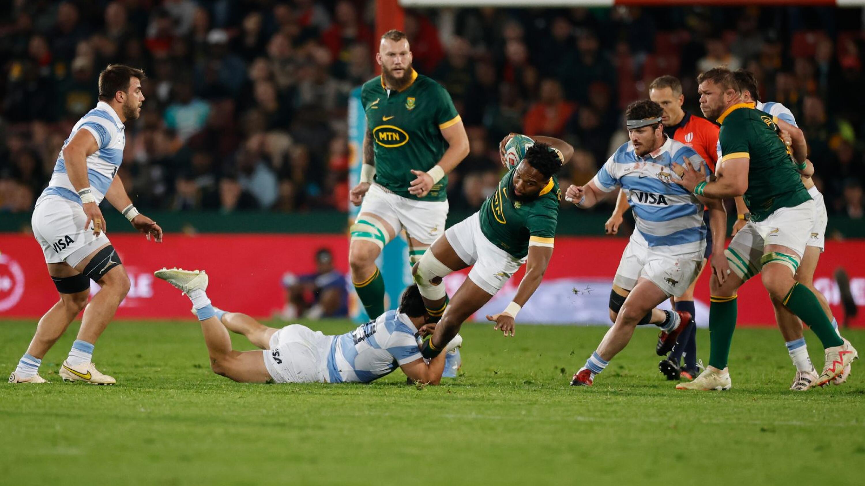 South Africa's center Lukhanyo Am (Centre R) is tackled by Argentina's wing Matias Moroni (Centre L) during the Rugby Championship. 
