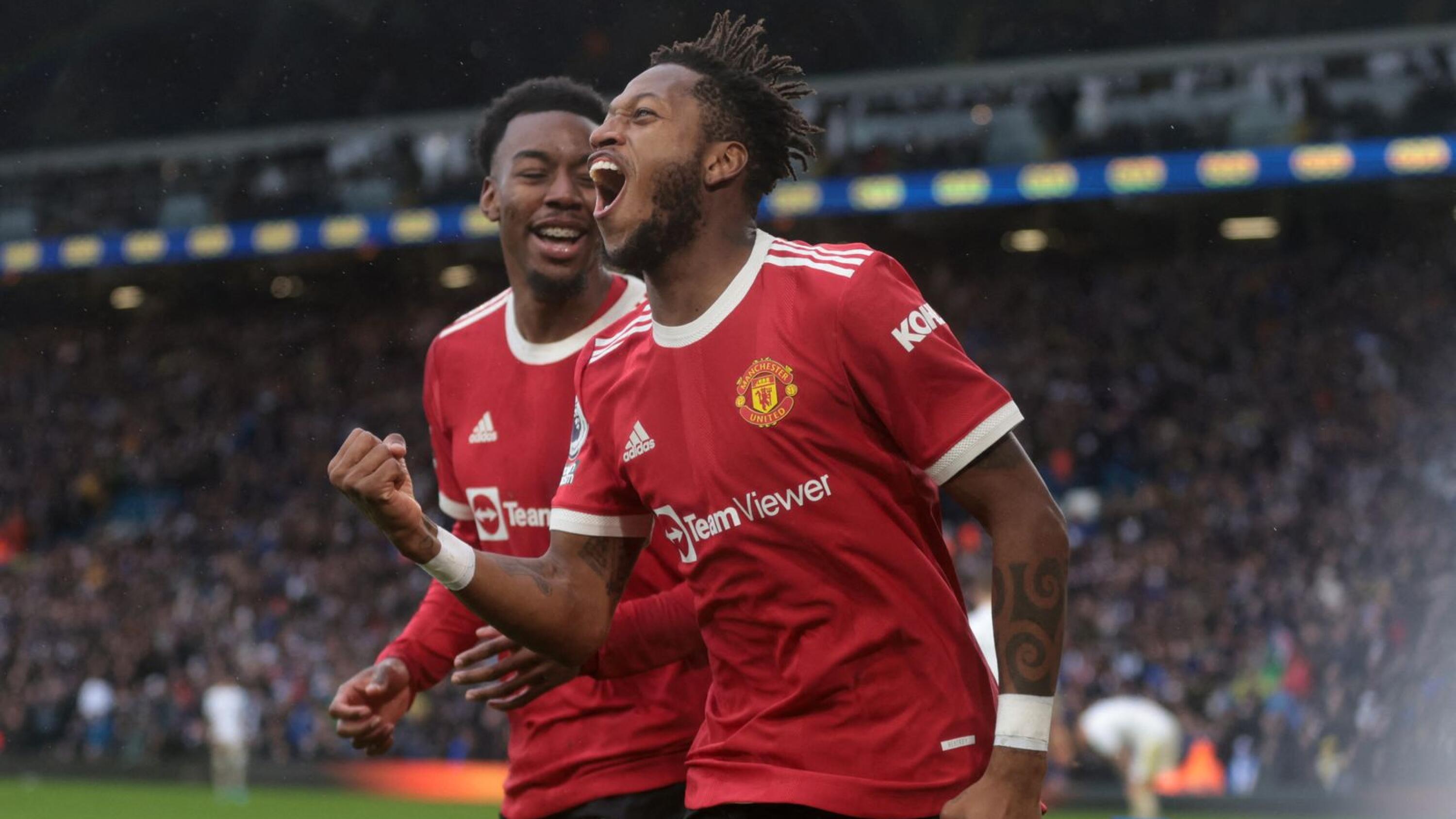 Manchester United's Fred celebrates with Anthony Elanga after scoring their third goal during their Premier League game against Leeds United at Elland Road on Sunday afternoon