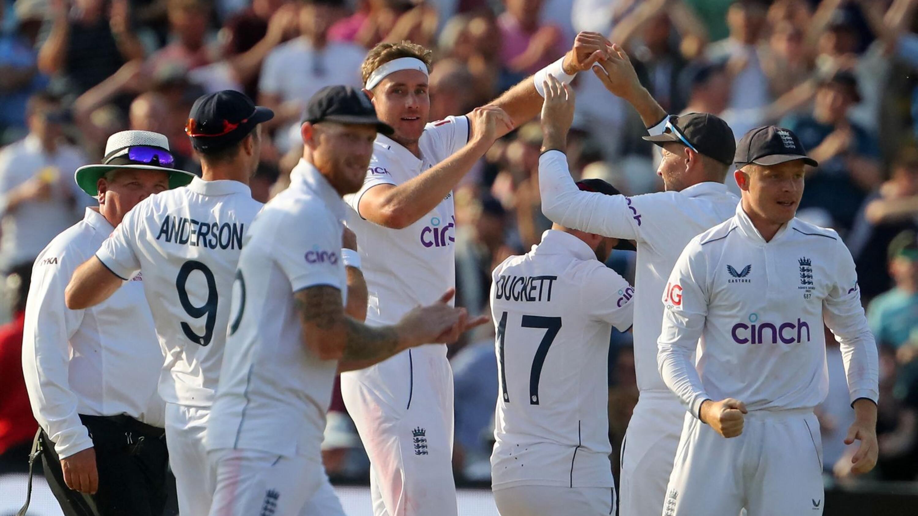 England's Stuart Broad celebrates with teammates after taking the wicket of Australia's Steve Smith on day four of the first Ashes cricket Test match at Edgbaston in Birmingham on  Monday