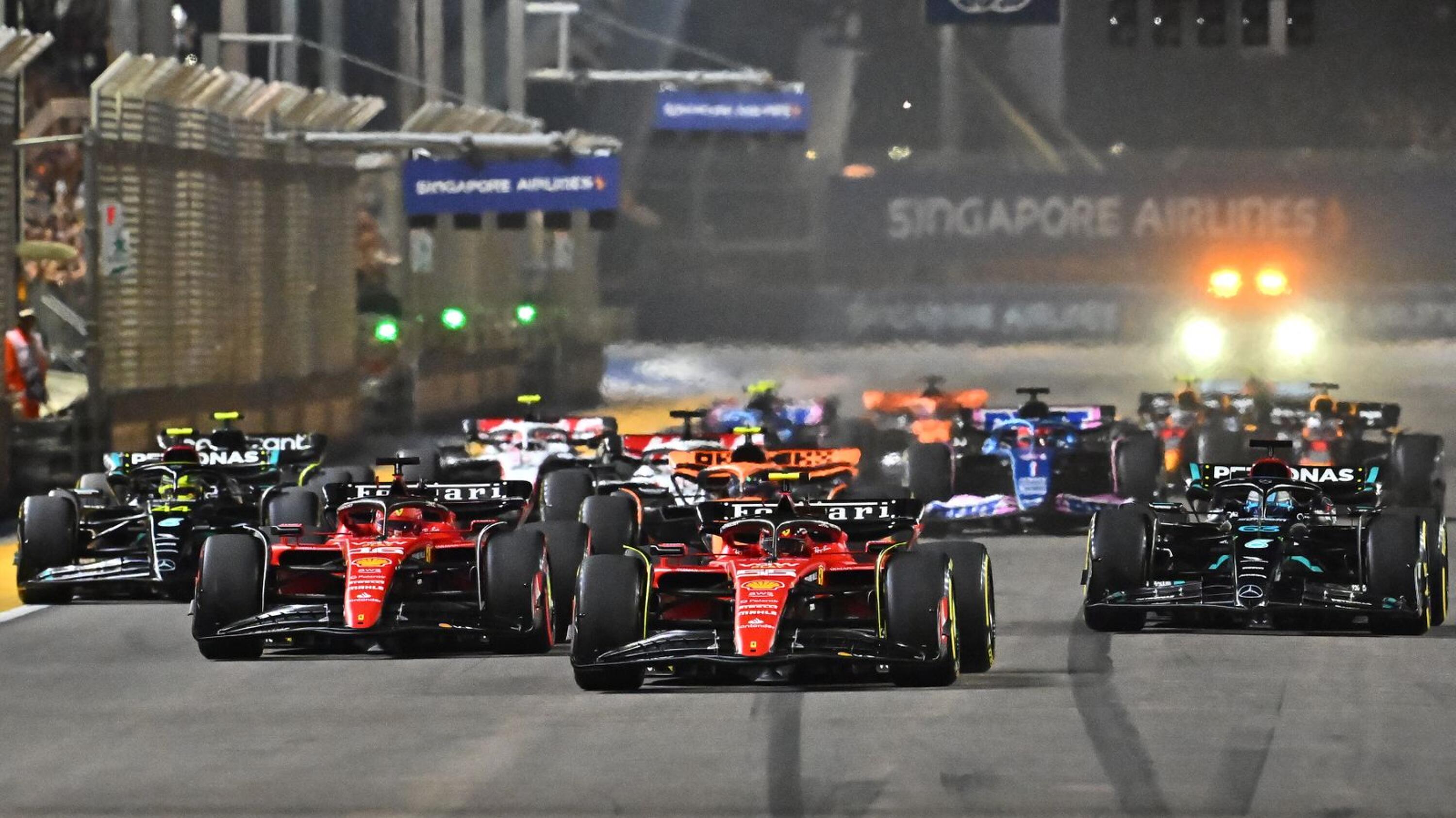 Ferrari's Spanish driver Carlos Sainz Jr drives in front of the field during the start of the Singapore Formula One Grand Prix night race
