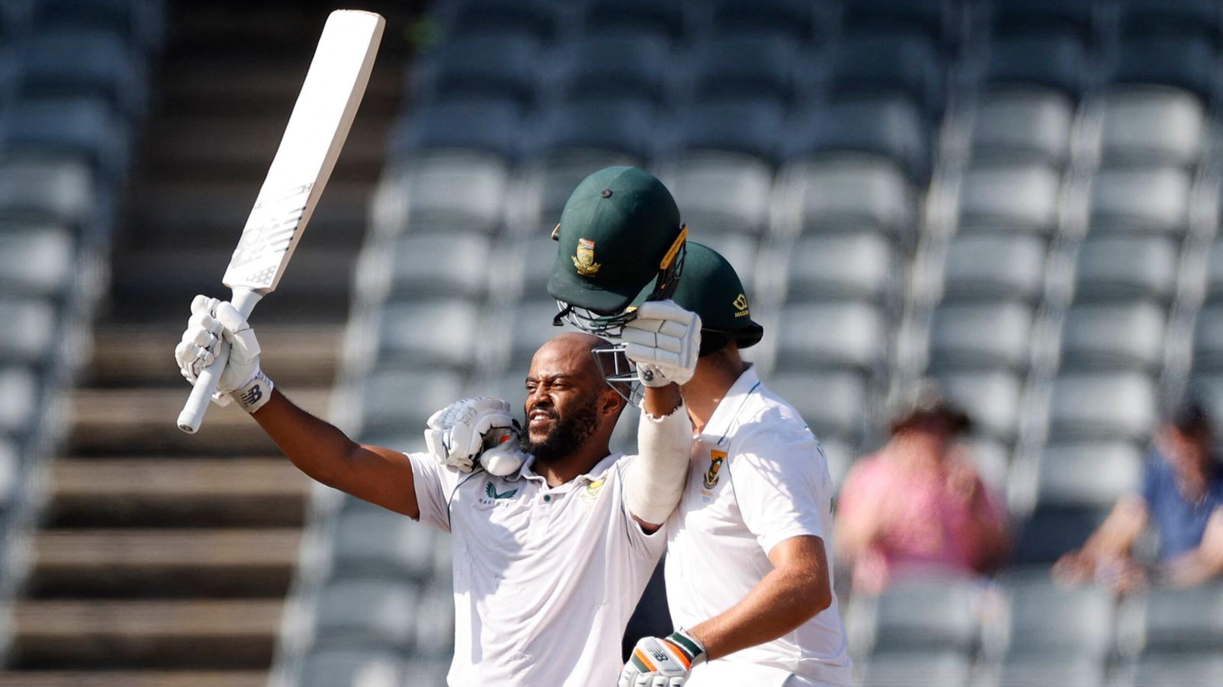 South Africa's Temba Bavuma celebrates with Wiaan Mulder after scoring a century during the third day of the second Test against the West Indies at The Wanderers Stadium in Johannesburg on Friday