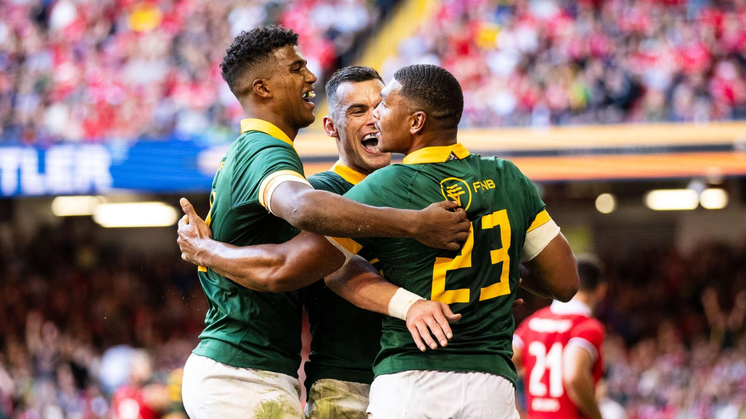 Damian Willemse of South Africa celebrates scoring his sides eighth try with team-mates Jesse Kriel & Canan Moodie during the Test match against Wales on 19 August 2023 at Principality Stadium in Cardiff, Wales