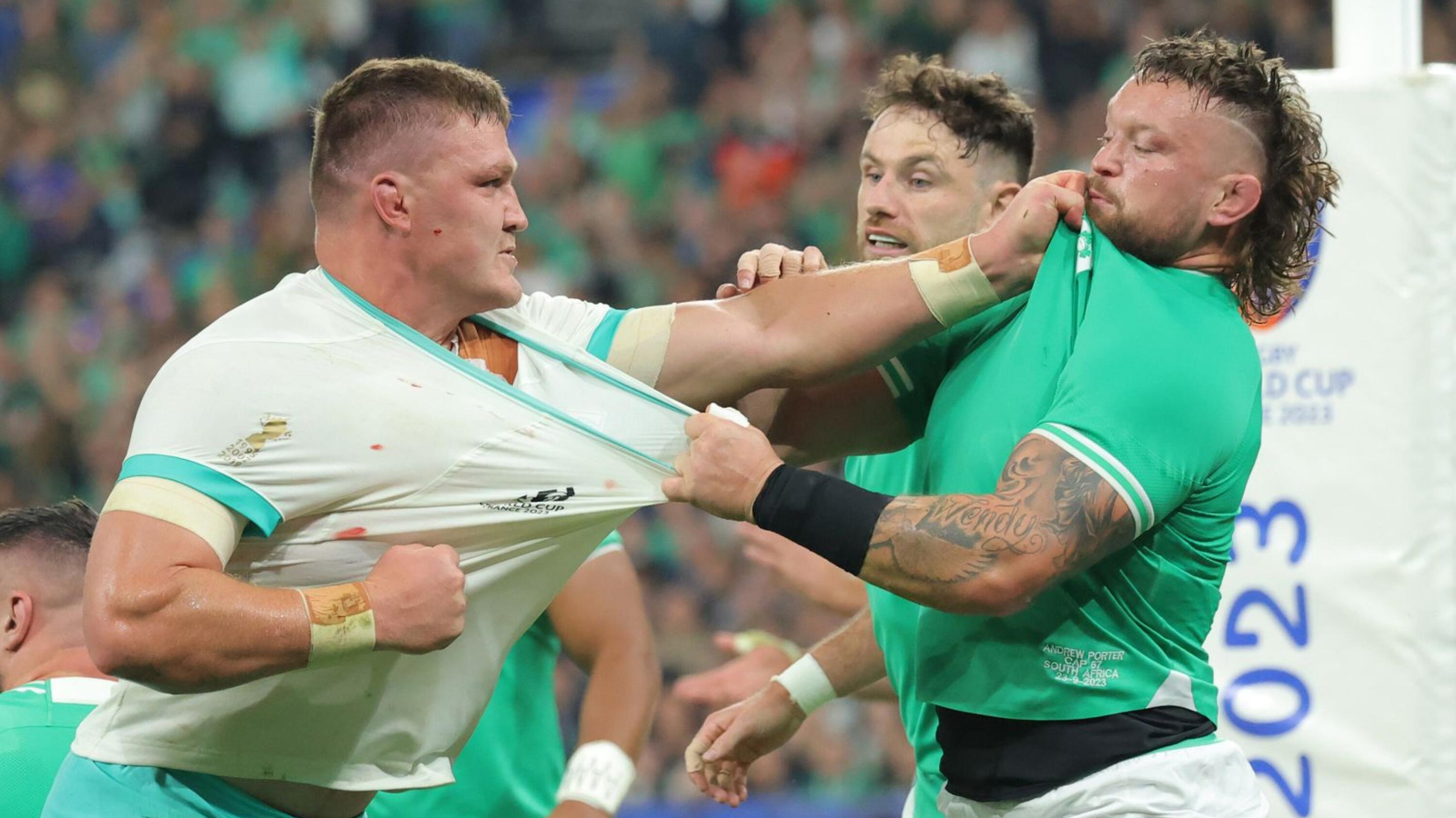 South Africa’s Jasper Wiese and Ireland’s Andrew Porter hold each other’s jersey during their Rugby World Cup Pool B match
