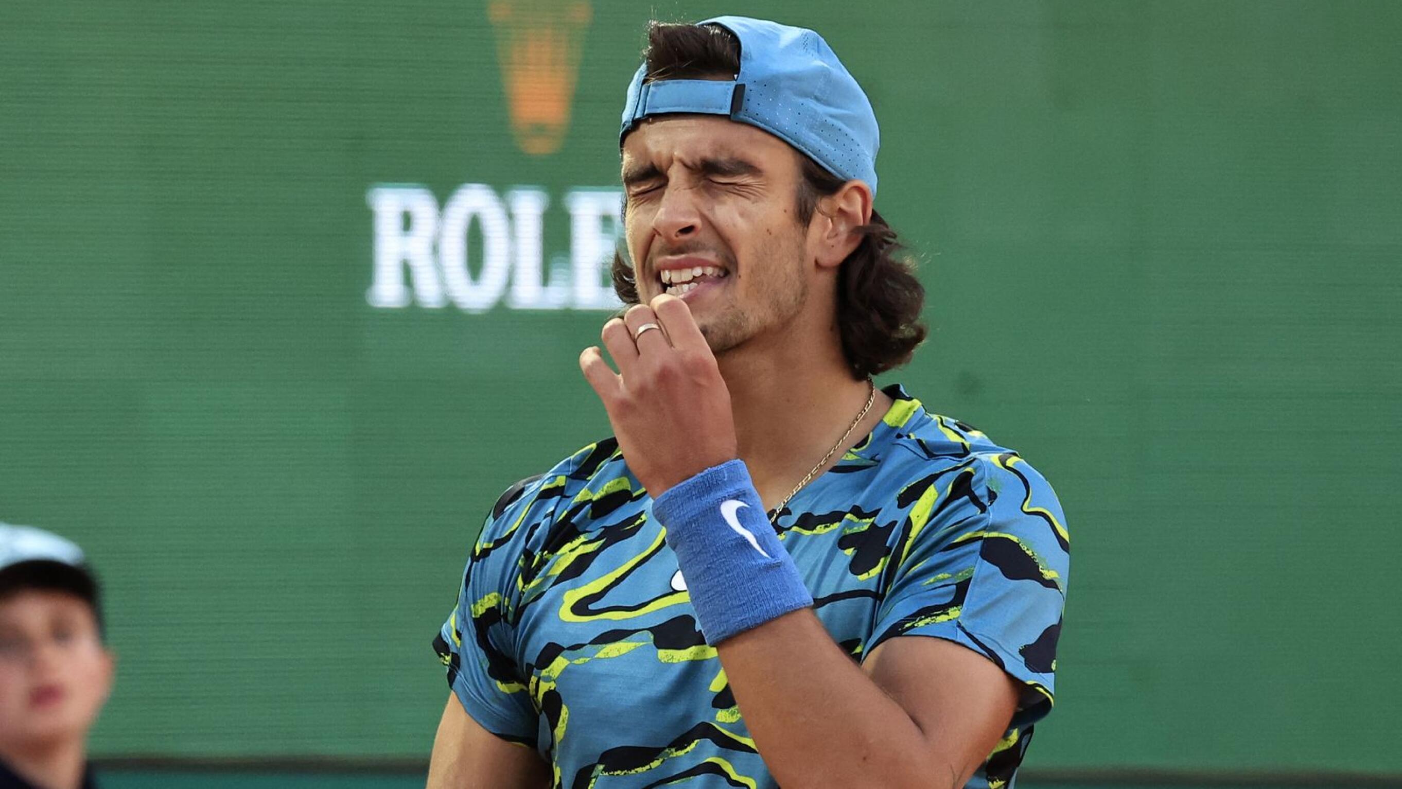 Italy's Lorenzo Musetti reacts during his match against Serbia's Novak Djokovic at the  Monte-Carlo ATP Masters Series tournament Round of 16 in Monte Carlo on Thursday