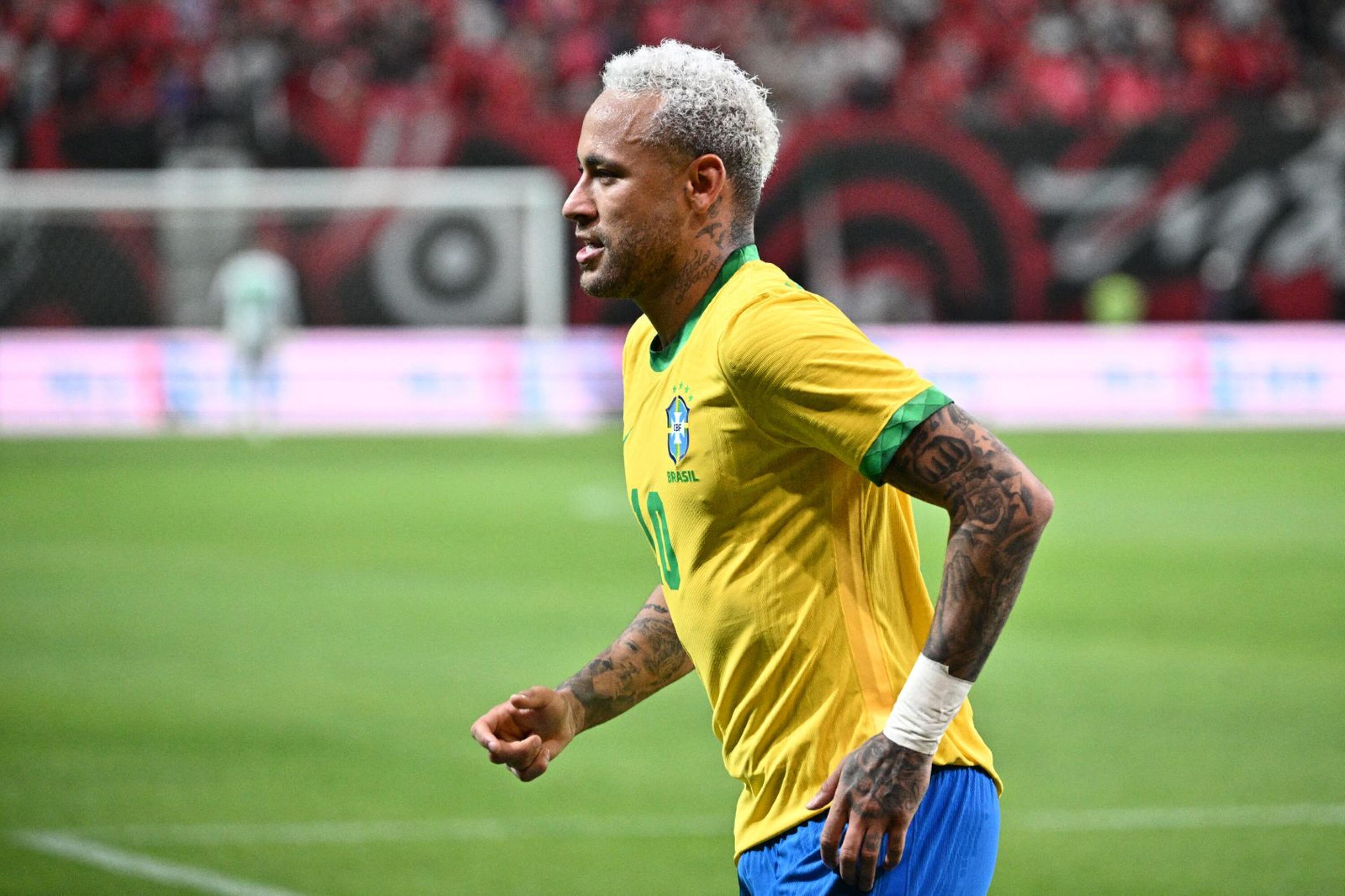 Brazil's forward Neymar celebrates after he scored a penalty goal during their international football friendly match against South Korea at Seoul World Cup Stadium in Seoul on Thursday