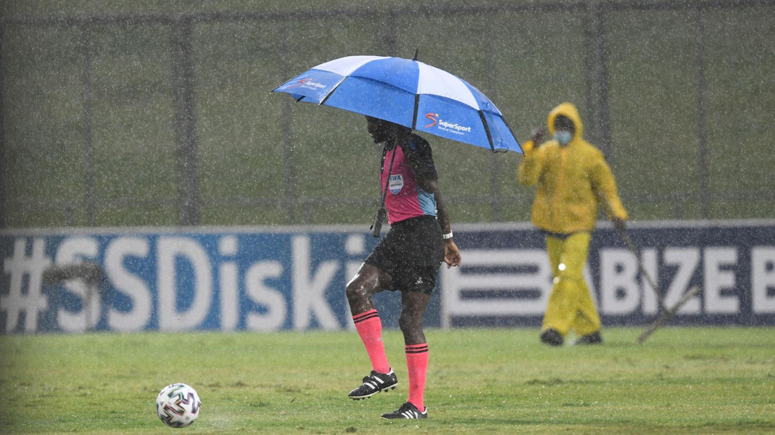 Match referee Jelly Chavani calls off the DStv Premiership match between Royal AM and Mamelodi Sundowns at Chatsworth Stadium in Durban due to rain