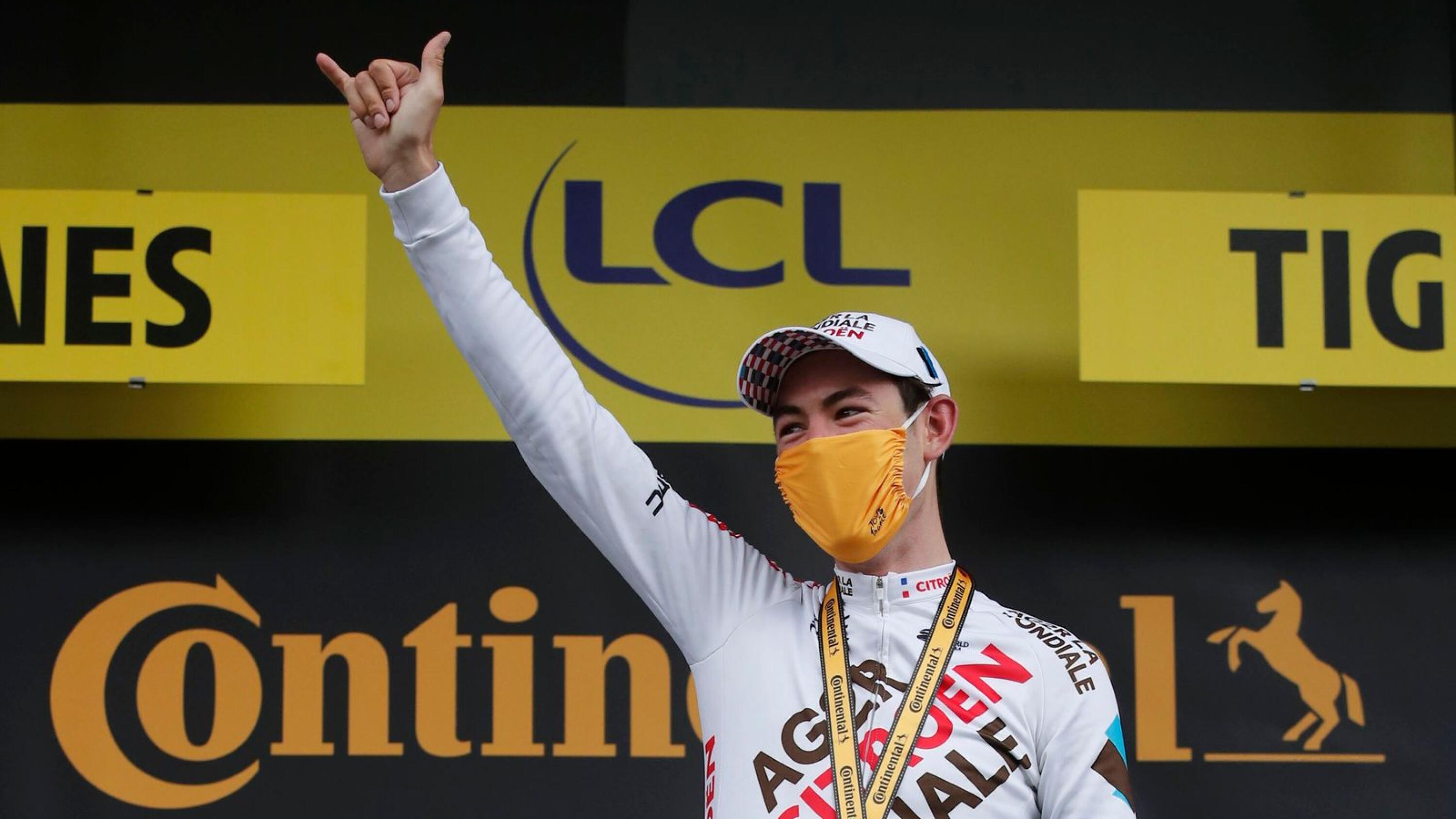 AG2R Citroen Team rider Ben O'Connor of Australia celebrates on the podium after winning stage 9 of the Tour de France on Sunday