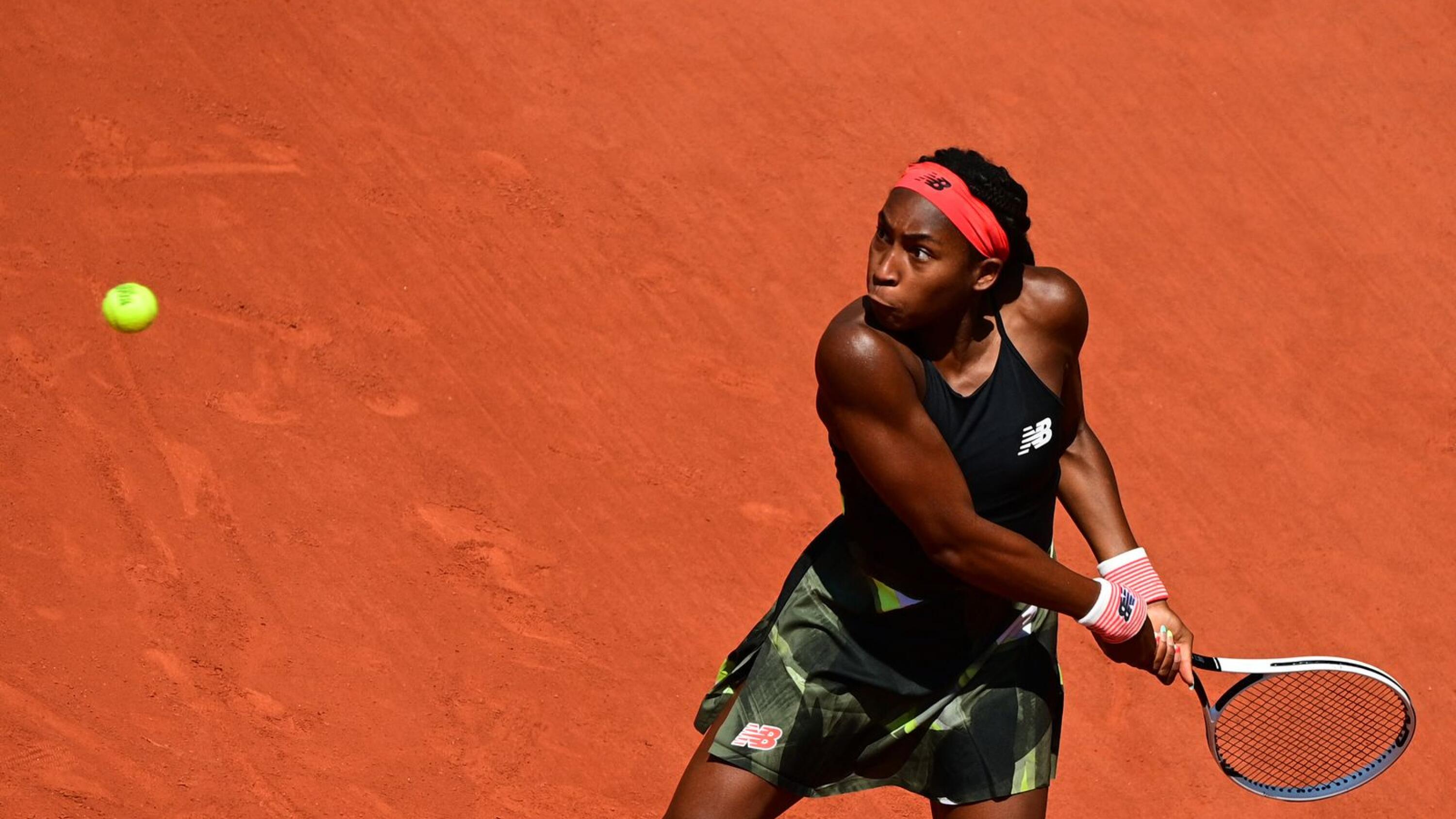 Coco Gauff of the US returns the ball to Tunisia's Ons Jabeur during their women's singles fourth round tennis match on Day 9 of The Roland Garros 2021 French Open tennis tournament in Paris on Monday