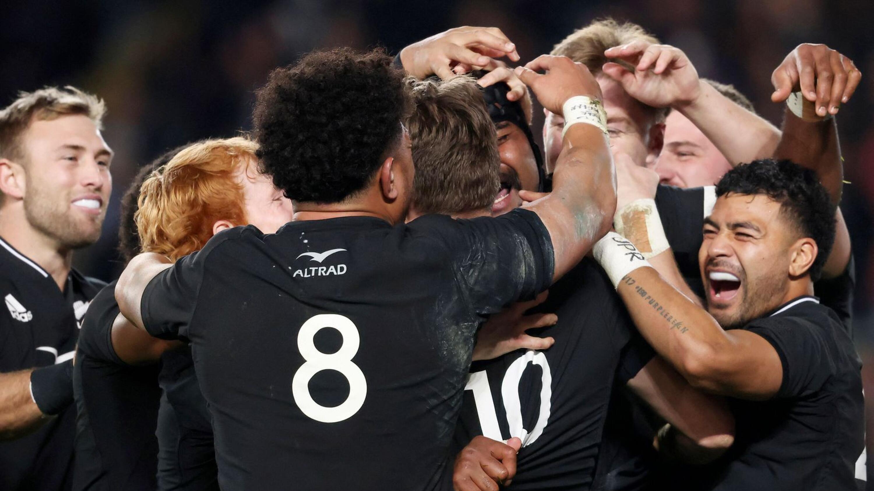 Pita Gus Sowakula (C) of New Zealand celebrates his try with teammates during the rugby Test match against Ireland at Eden Park in Auckland on Saturday