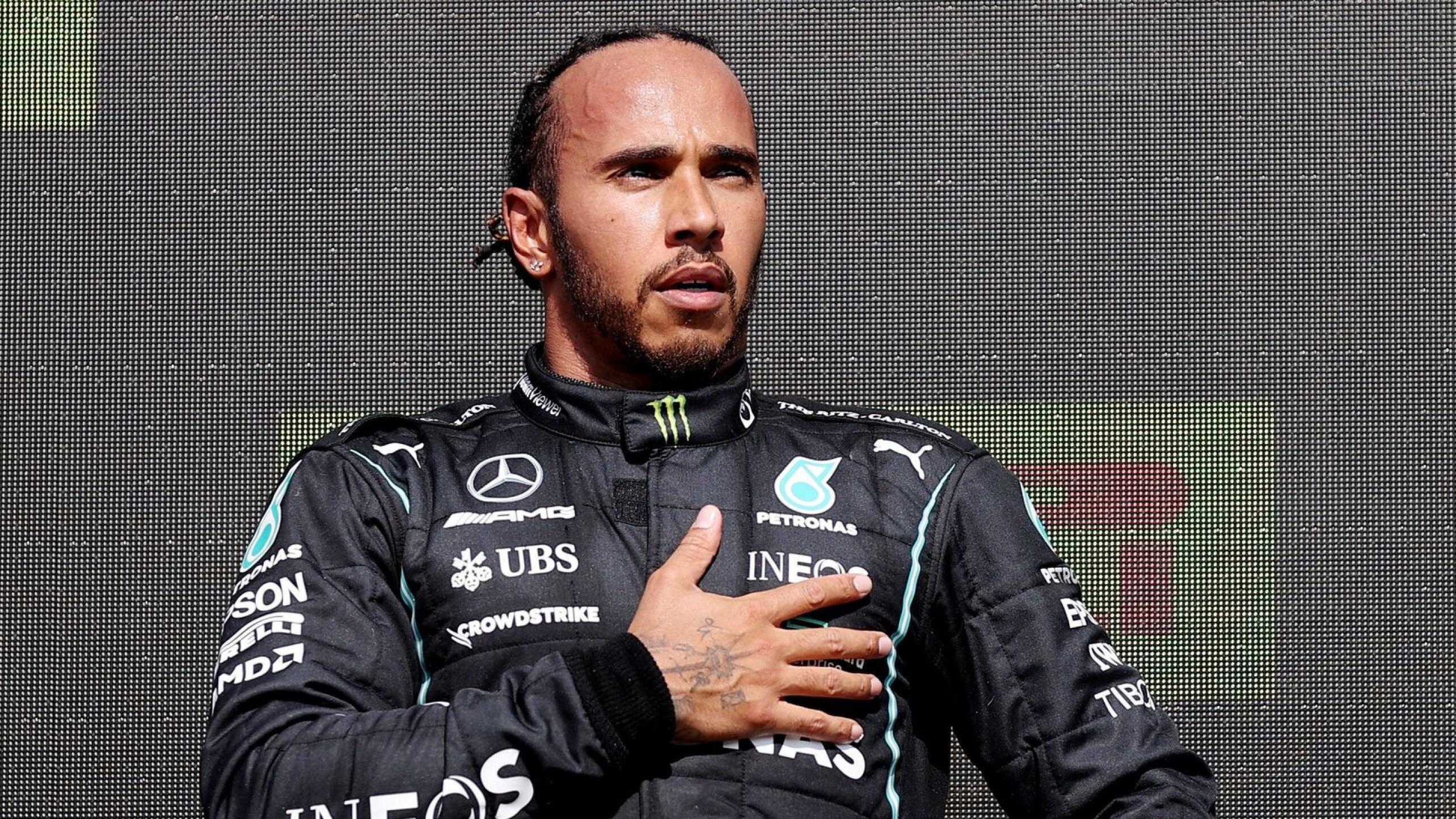 Mercedes' Lewis Hamilton celebrates on the podium after winning the British Grand Prix